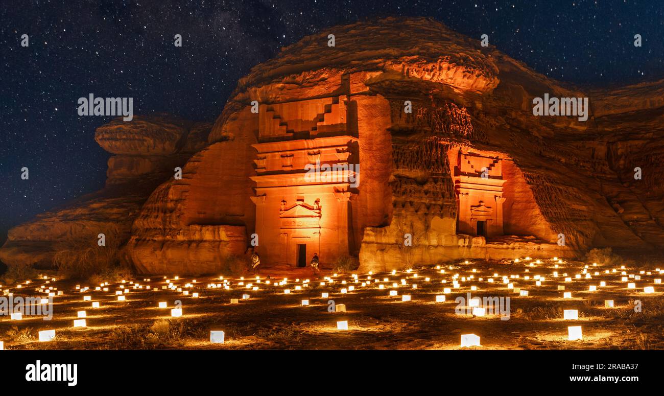 Guarded ancient tombs of nabataean Hegra Mada'in Salih city illuminated during the night, Al Ula, Saudi Arabia Stock Photo