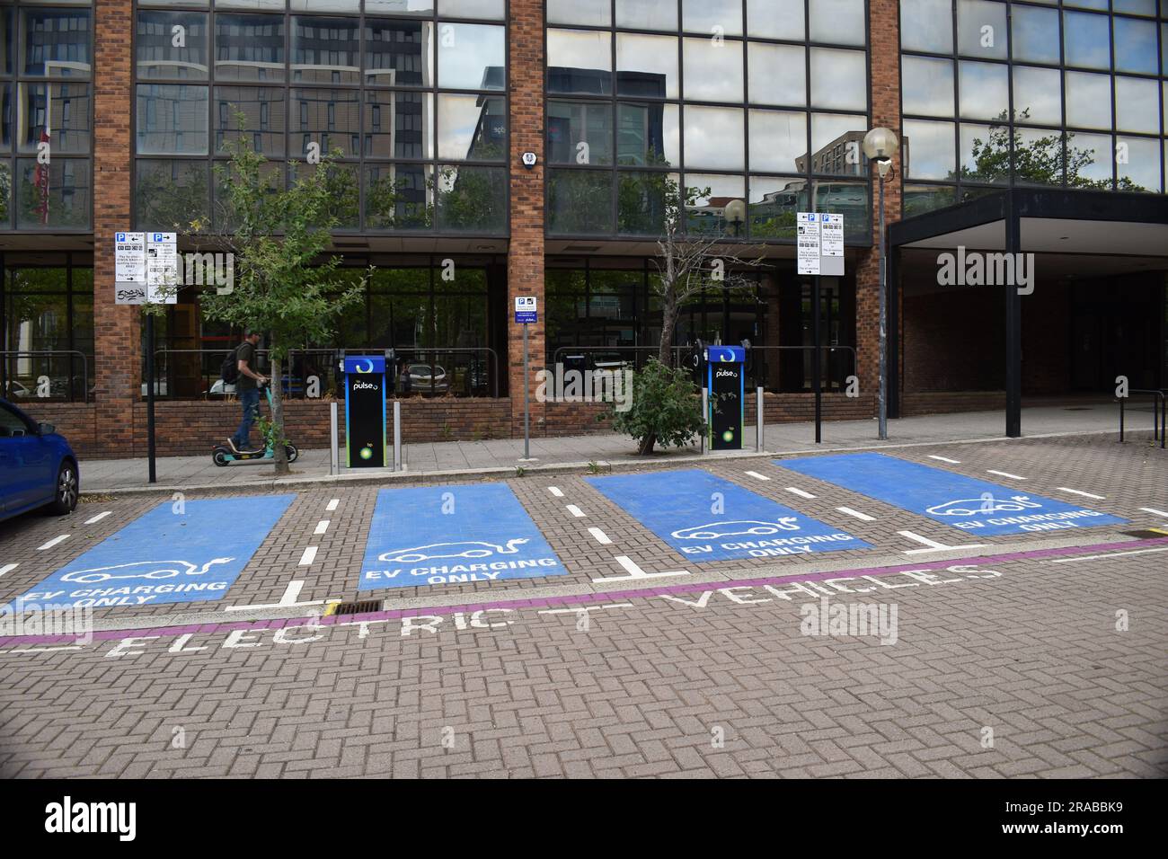 Four parking spaces for EV charging in Central Milton Keynes. Stock Photo