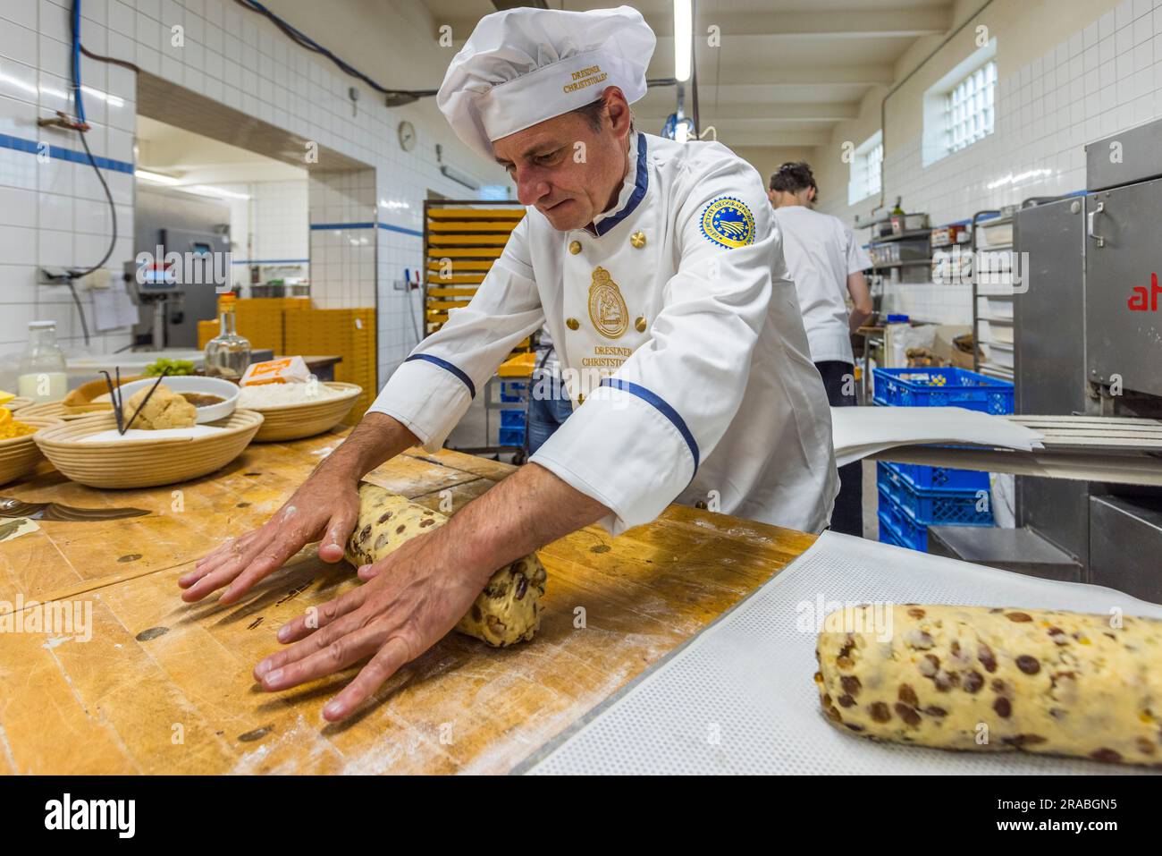 Production of an original Dresden Christstollen in Dresden, Germany. Master baker Tino Gierig rolls the stollen dough Stock Photo