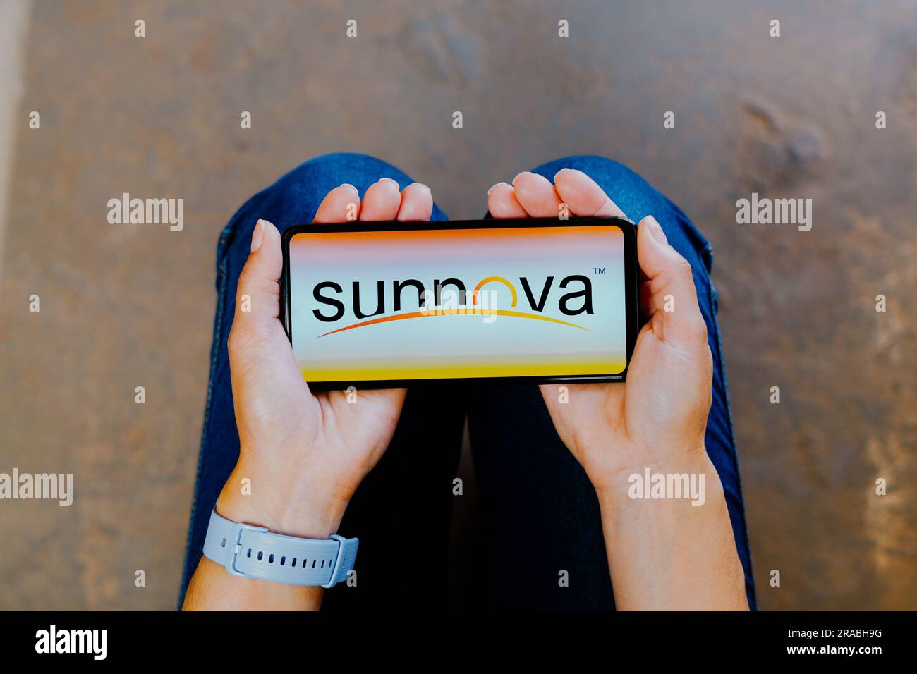 In this photo illustration, the Sunnova Energy logo is displayed on a