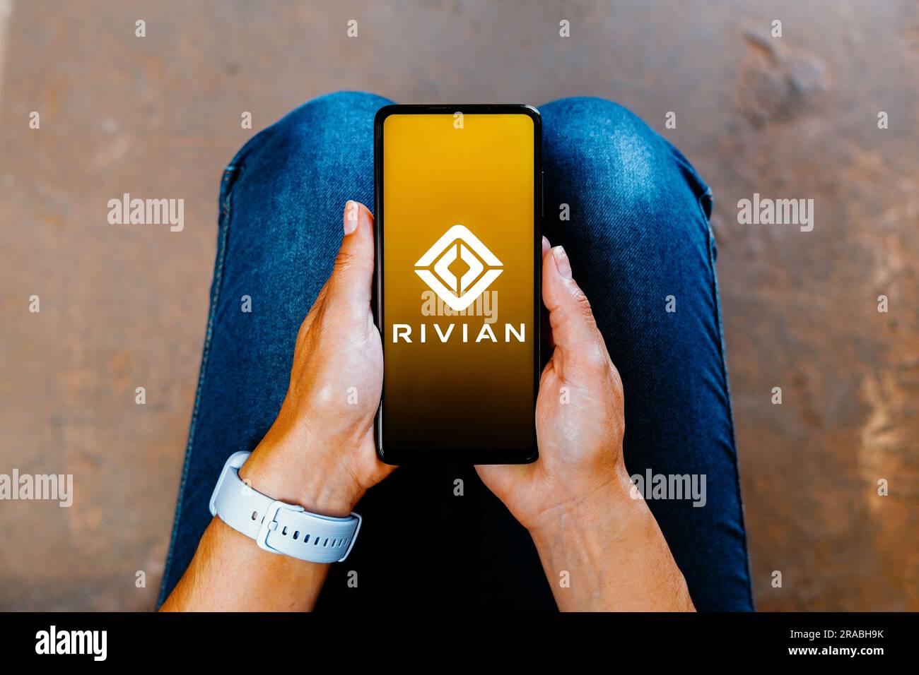 In this photo illustration, the Rivian logo is displayed on a smartphone screen. Stock Photo