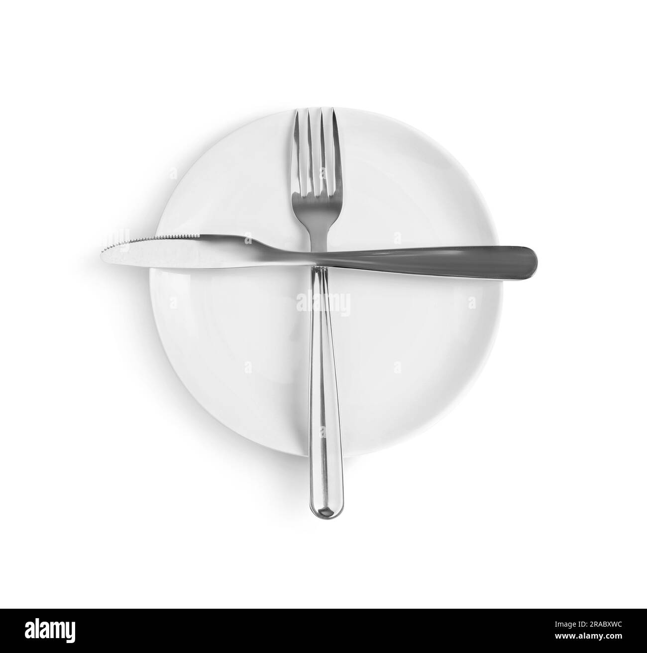 Ceramic plate, fork and knife on white background, top view Stock Photo ...