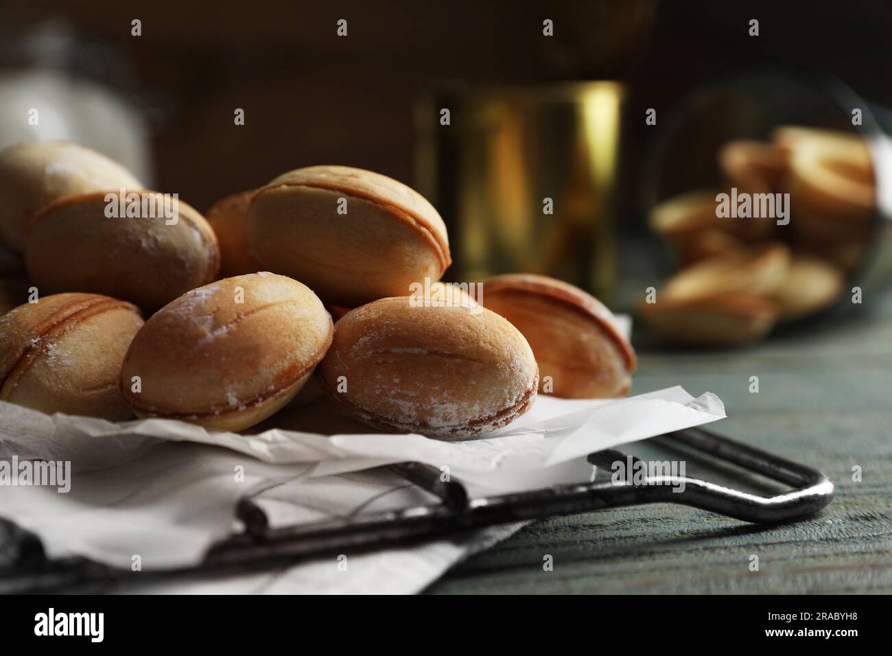 Hand taking hot nutty cookies out of steaming convection oven of kitchen  stove. Fresh baked shortbread pastry in silicone baking molds on metal  sheet Stock Photo - Alamy