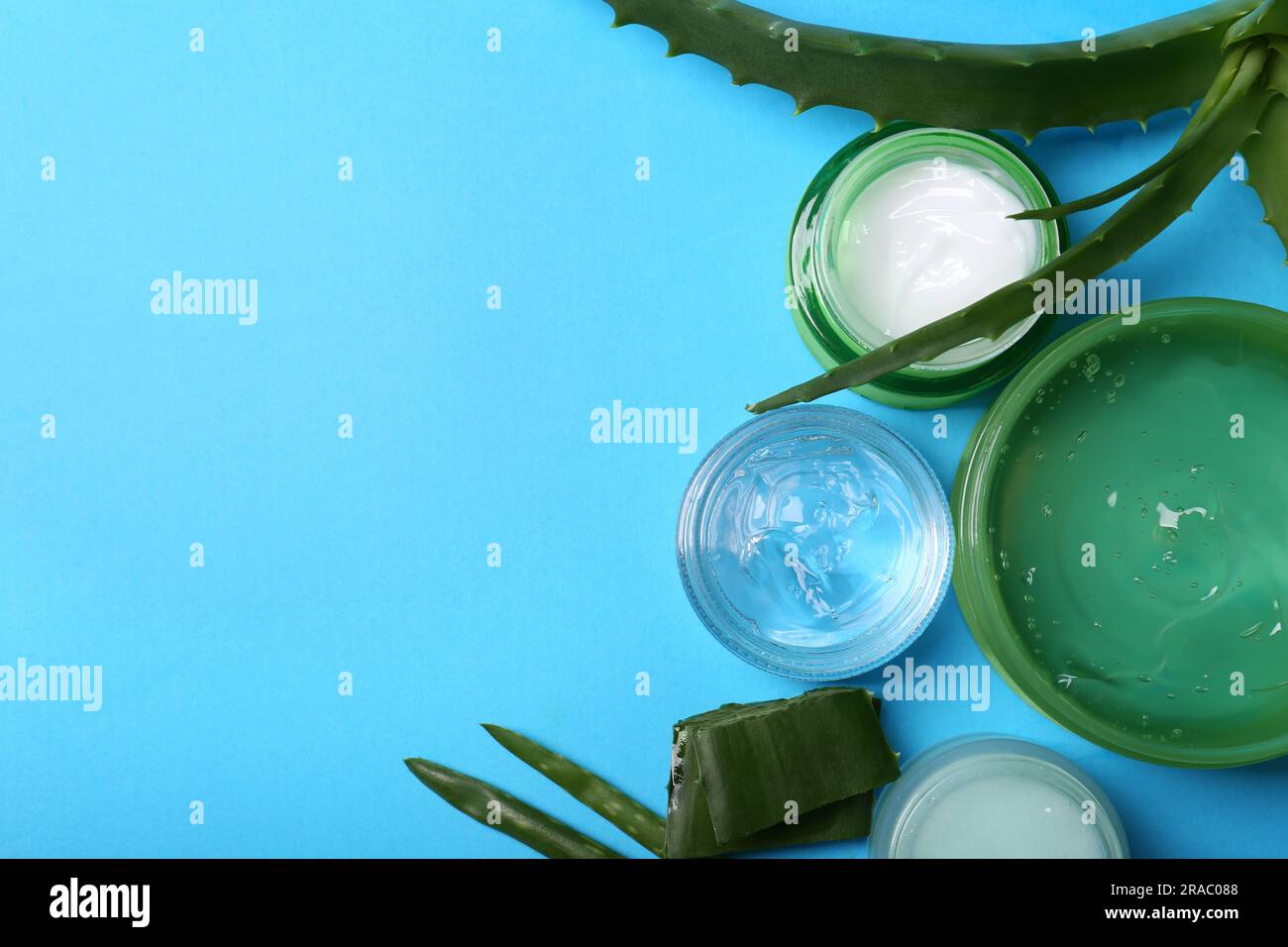 Flat lay composition with aloe and different cosmetic products on light ...