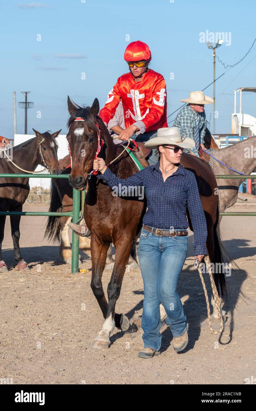 Male Jockey wearing a red tunic at the Brunette Downs ABC Bush races traditional Outback event, Northern Territory, NT, Australia Stock Photo