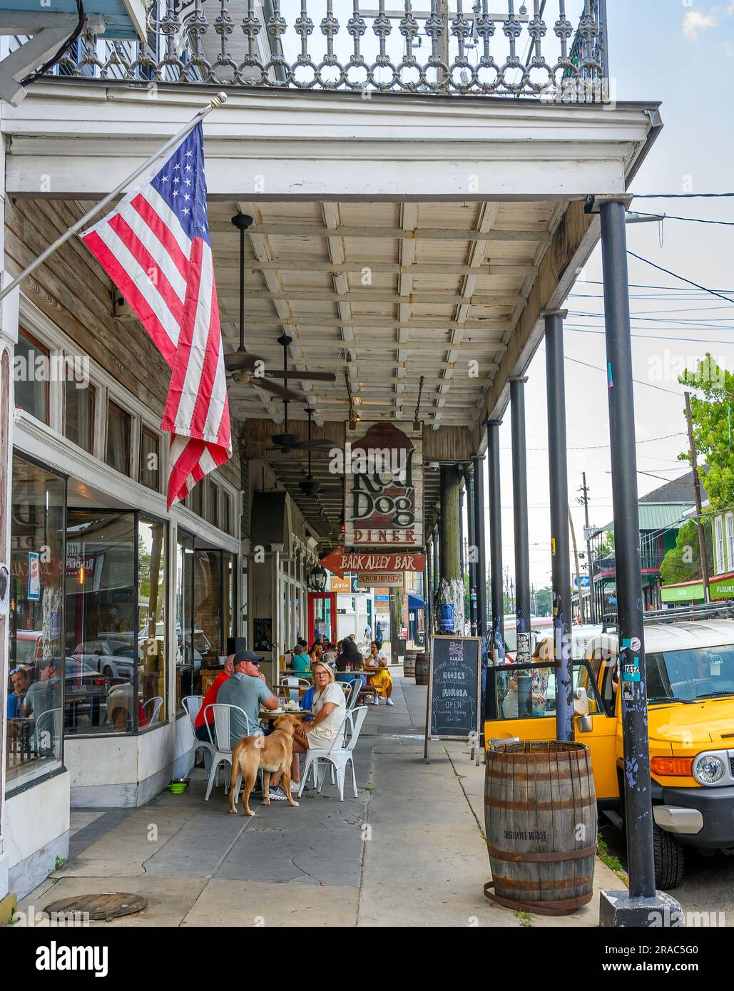NEW ORLEANS, LA, USA JULY 1, 2023 Outdoor diners on the sidewalk at