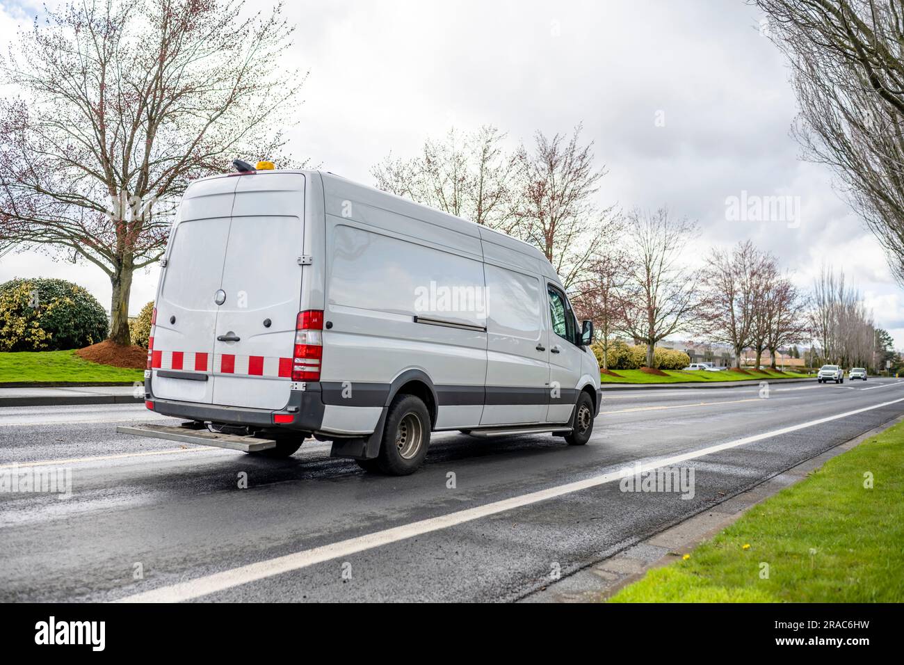 White compact light duty maneuverable economical cargo mini van with