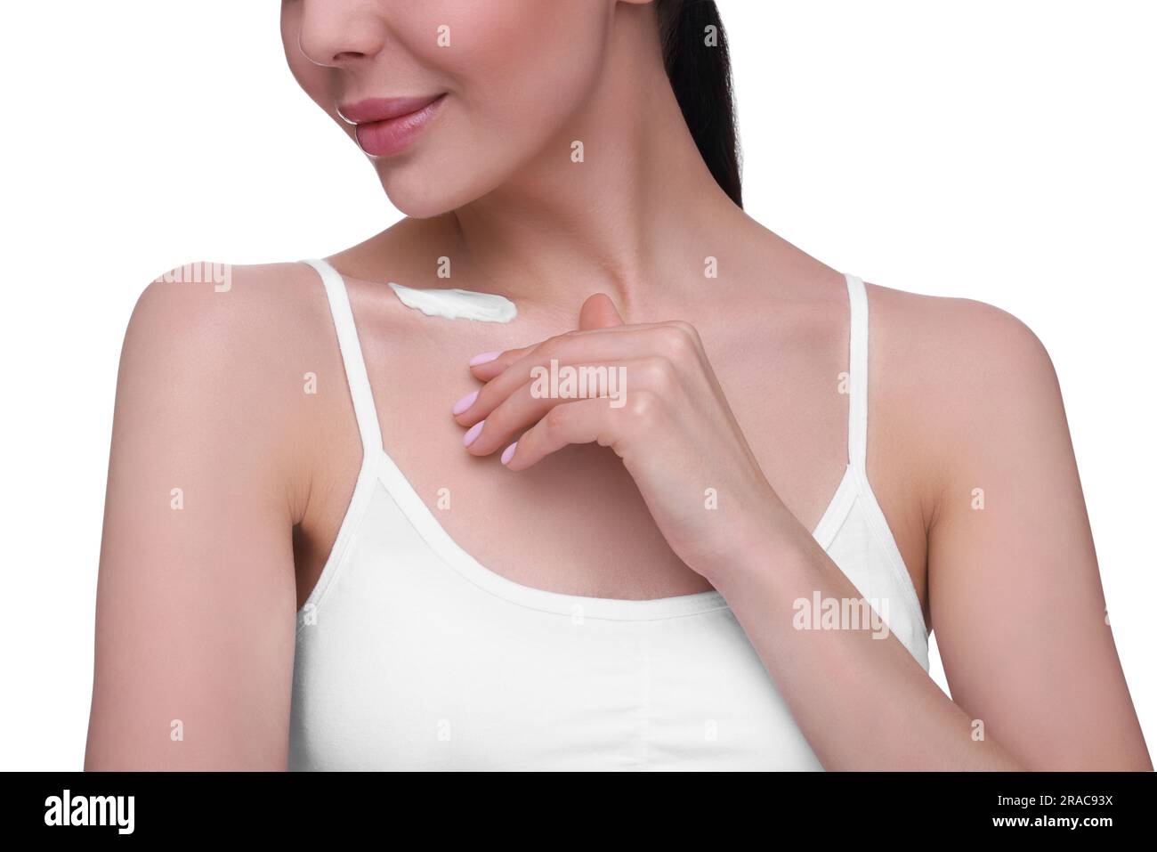 Woman with smear of body cream on her collarbone against white background, closeup Stock Photo