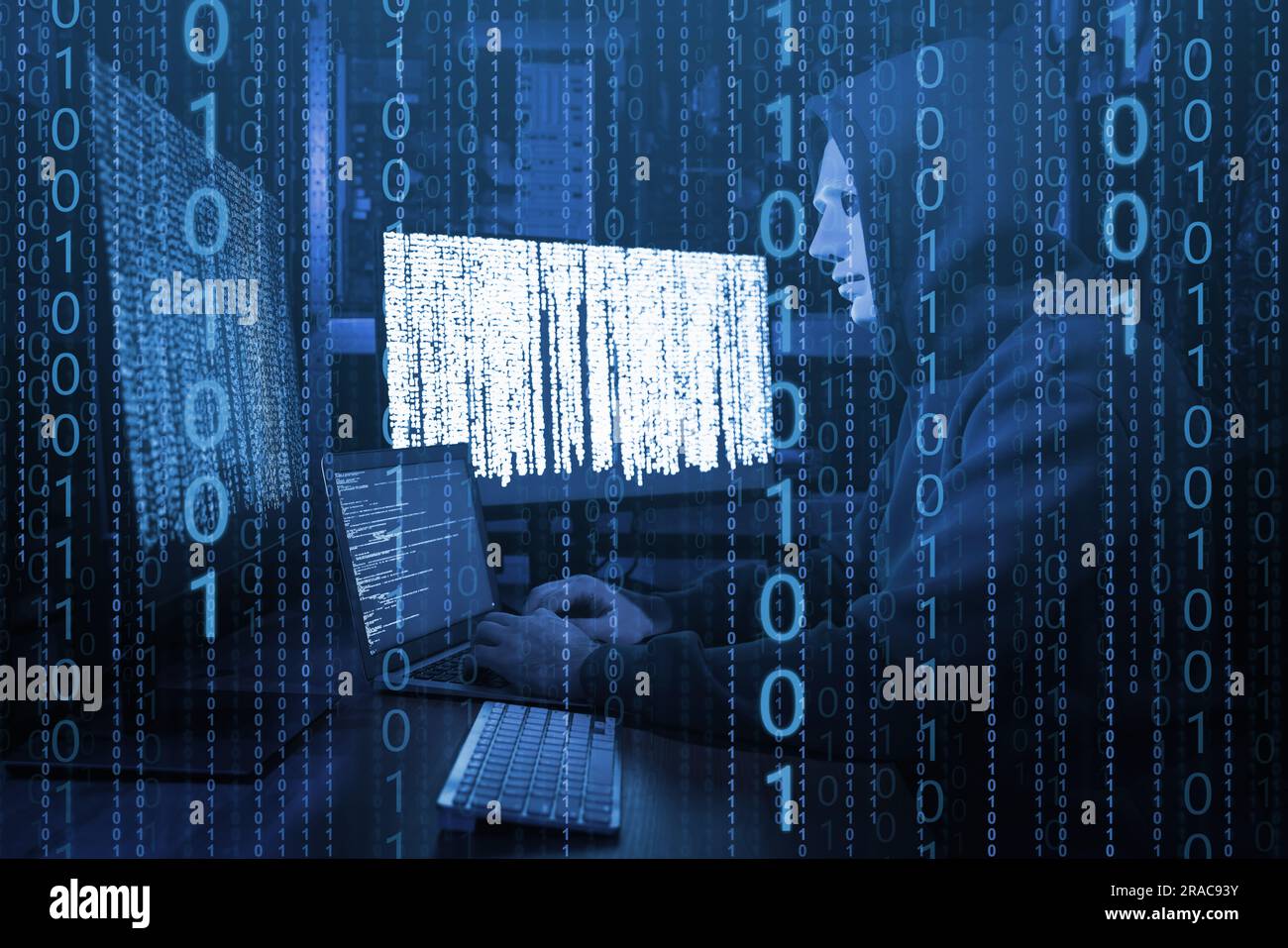 Anonymous man in mask with computers and binary code in darkness Stock Photo