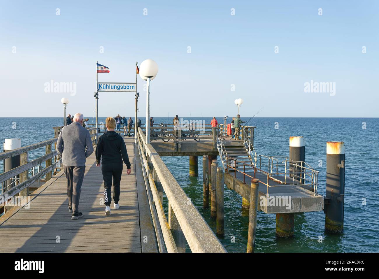 Holidaymakers and fishermen on the pier of Kühlungsborn on the German Baltic Sea coast Stock Photo