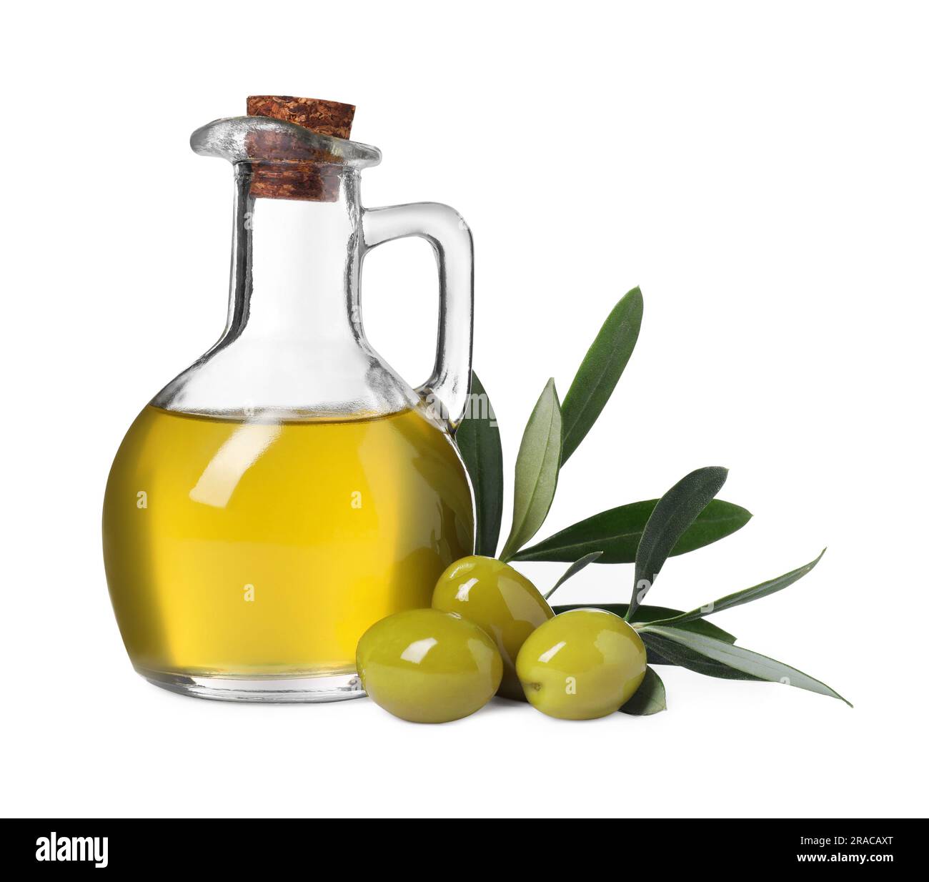 Glass jug of cooking oil, ripe olives and green leaves isolated on