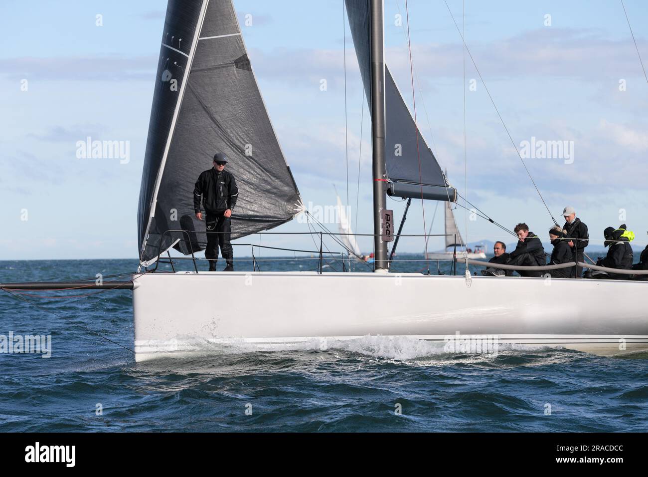 Large yachts are seen competing in Race 1 of the Winter Series held in choppy seas in Port Phillip Bay, Melbourne, Australia Stock Photo