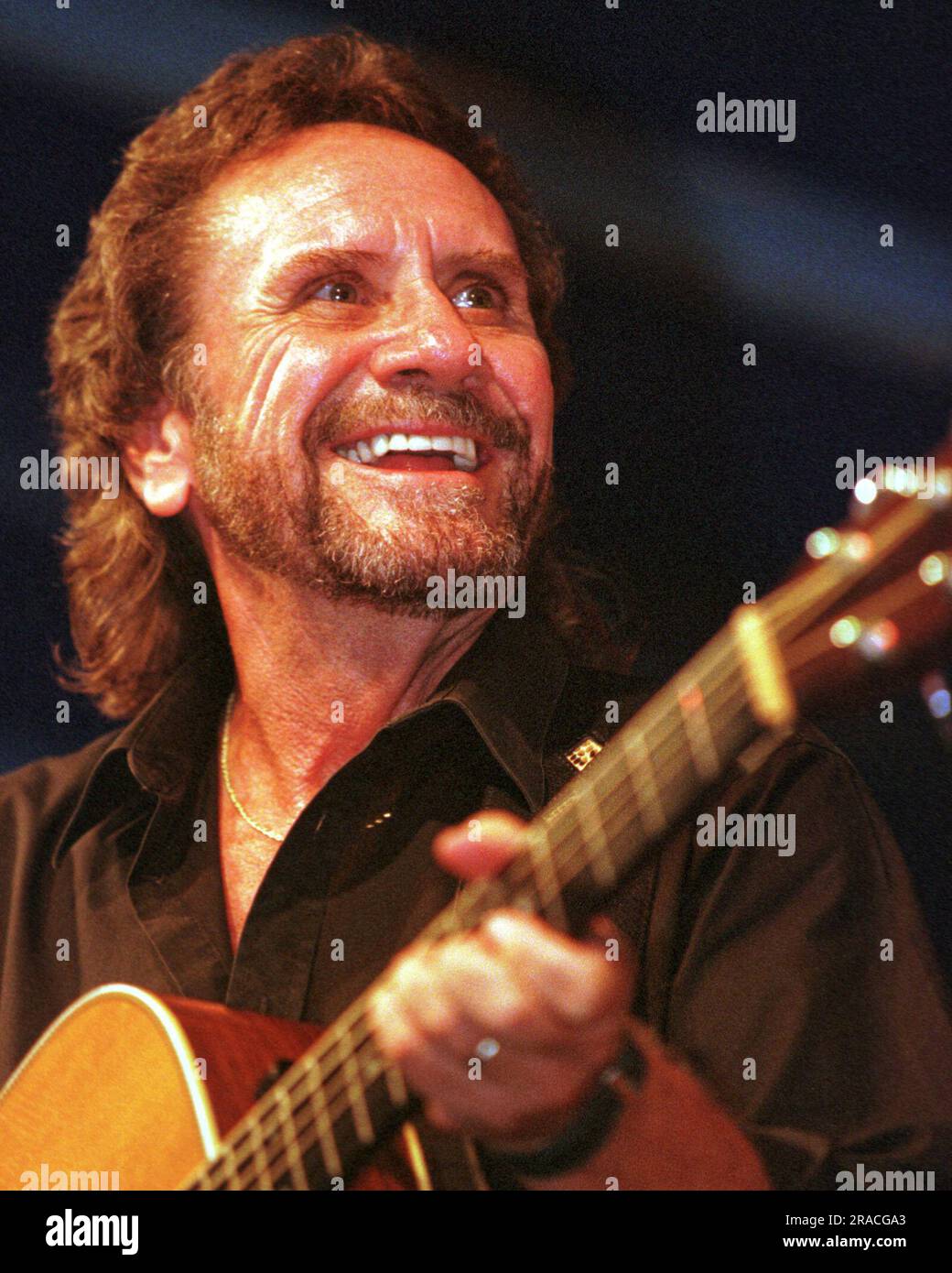 David Frizzell, 57, performs during the Lakefest Fourth of July Celebration on Saturday, July 3, 1999 in Jamestown, Russell County, KY, USA. The younger brother of country singer-songwriter Lefty Frizzell and a native of El Dorado, AR, David Frizzell is perhaps best known for charting two number-one singles on the Billboard Hot Country Songs chart in the 1980s: the 1981 Shelly West duet 'You're the Reason God Made Oklahoma' and the 1982 solo hit 'I'm Gonna Hire a Wino to Decorate Our Home.' (Apex MediaWire Photo by Billy Suratt) Stock Photo