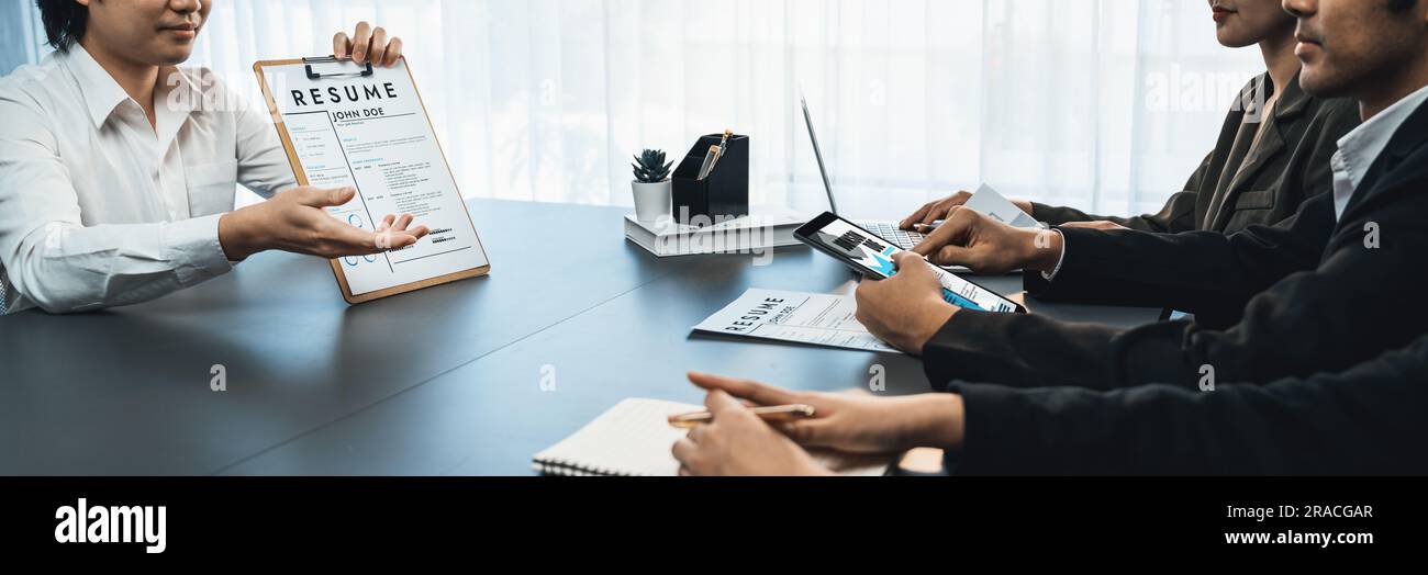 Candidate and interviewers discuss work experience and qualifications