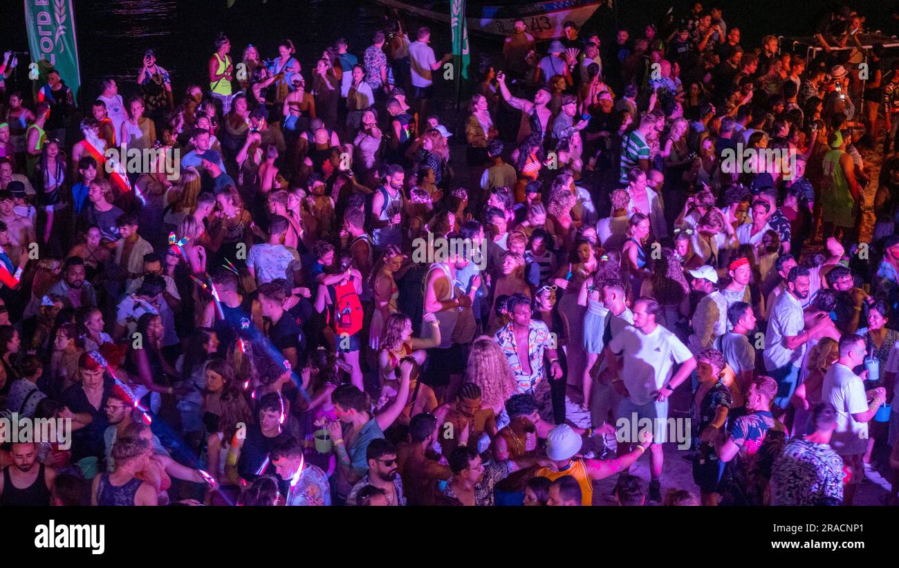 Crowds of people dance during the Full Moon Party on Hat Rin beach on ...