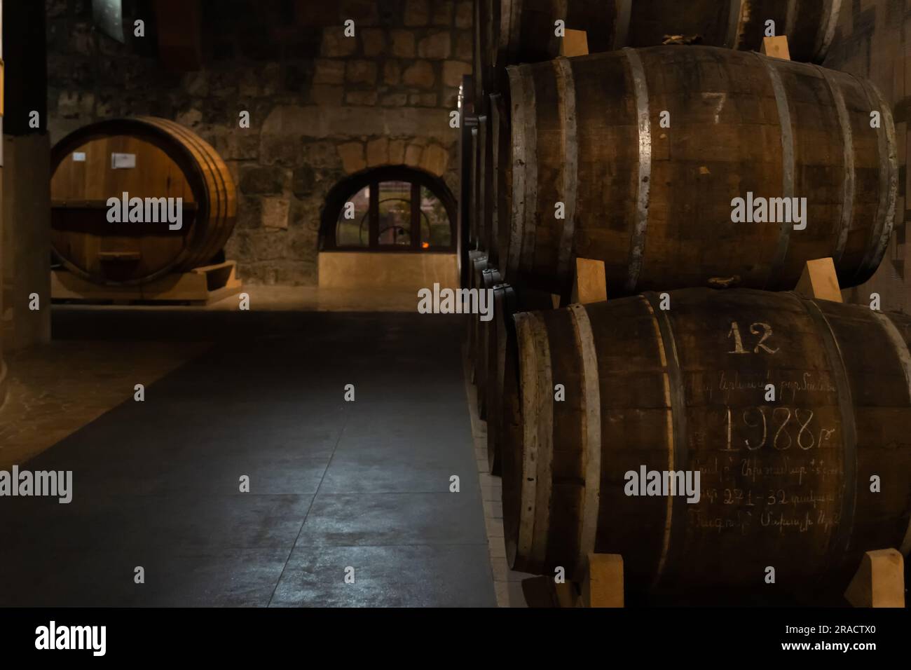 Yerevan, Armenia - May 28 2023: Cellar of the Ararat brandy factory in Yerevan. Barrels of cognac in the cellar. Stock Photo