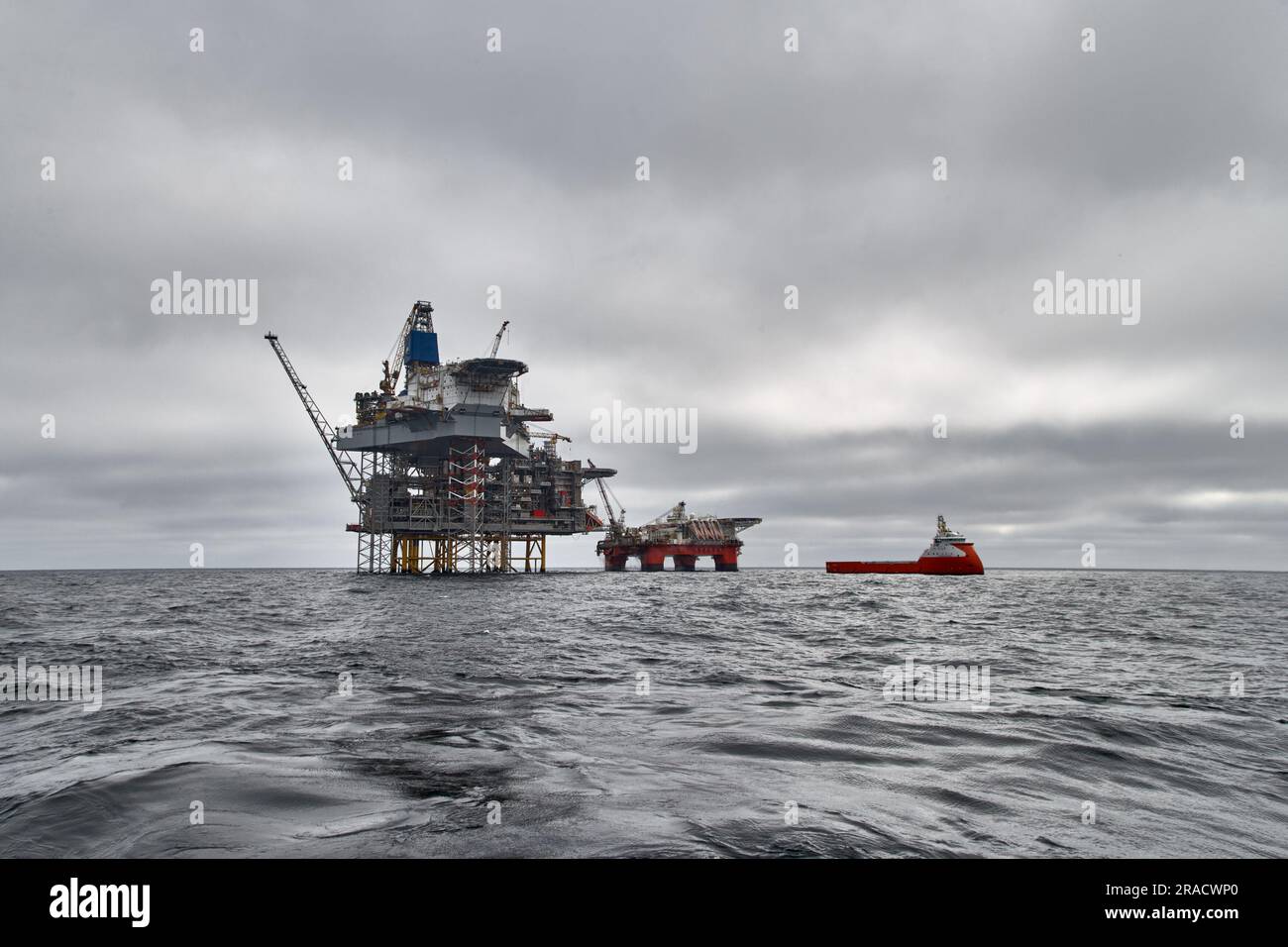 Jack up drilling rig, semi submersible platform and supply vessel on a ...