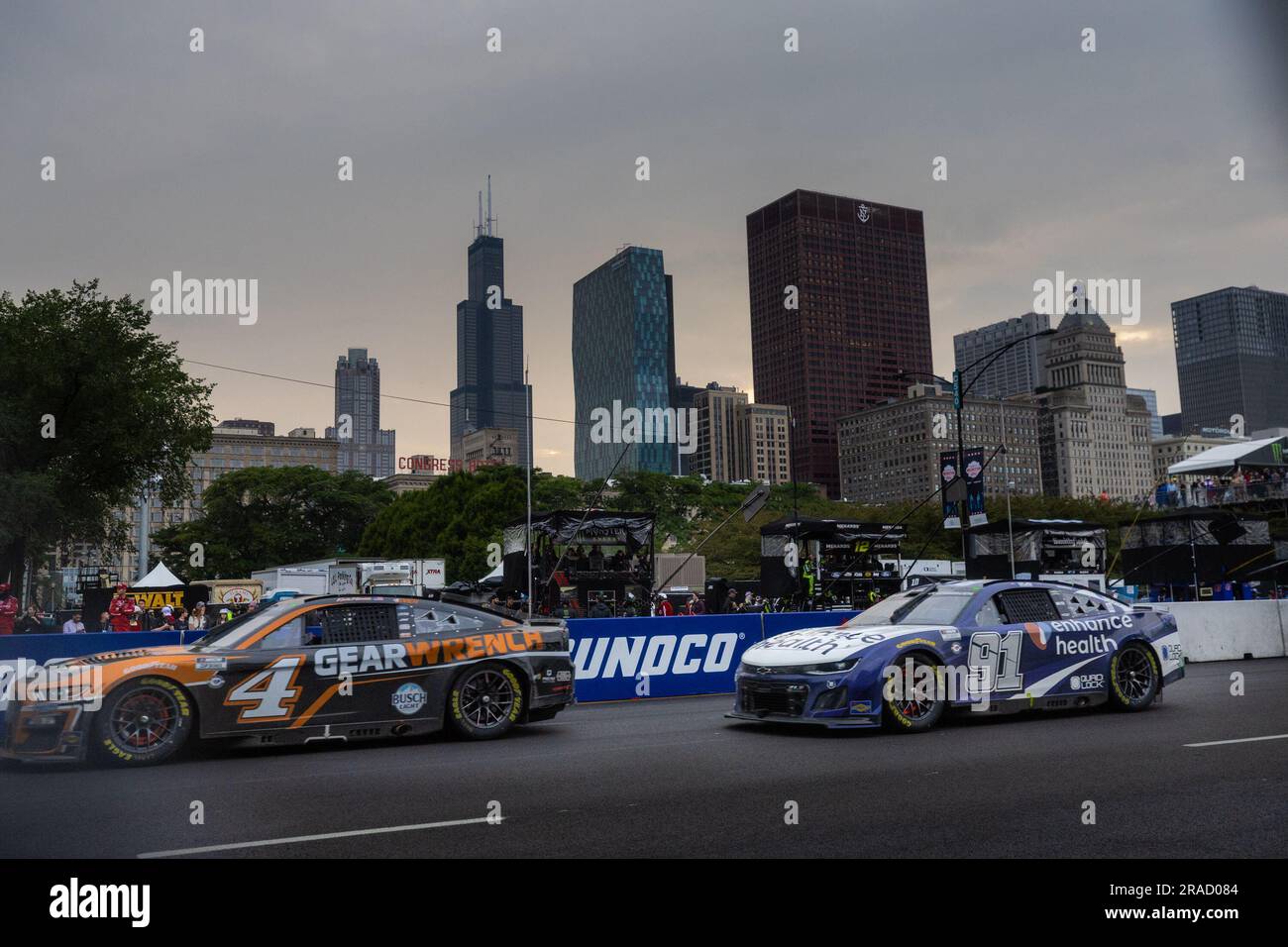 Chicago, USA. 2nd July, 2023. Shane van Gisbergen (R) and Kevin Harvick compete during the NASCAR Chicago Street Race in Grant Park in Chicago, the United States, on July 2, 2023. Credit: Vincent Johnson/Xinhua/Alamy Live News Stock Photo