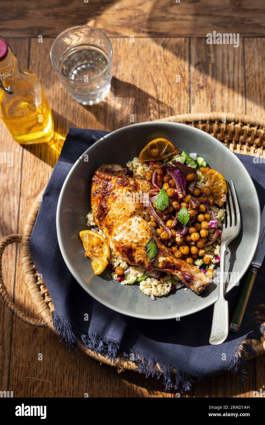Roast chicken with chickpeas and couscous Stock Photo Alamy