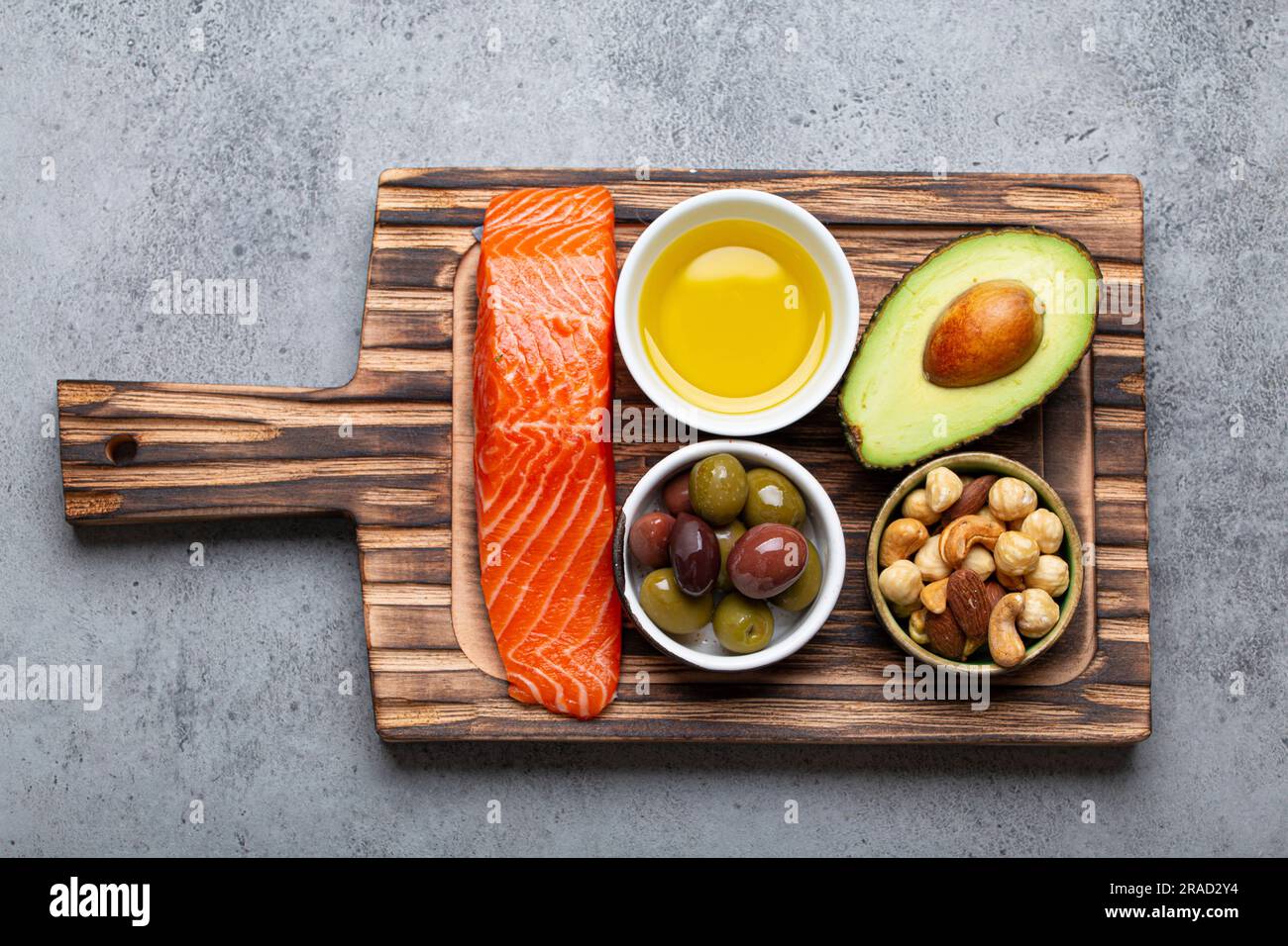 Food sources of healthy unsaturated fat fresh salmon fillet, avocado