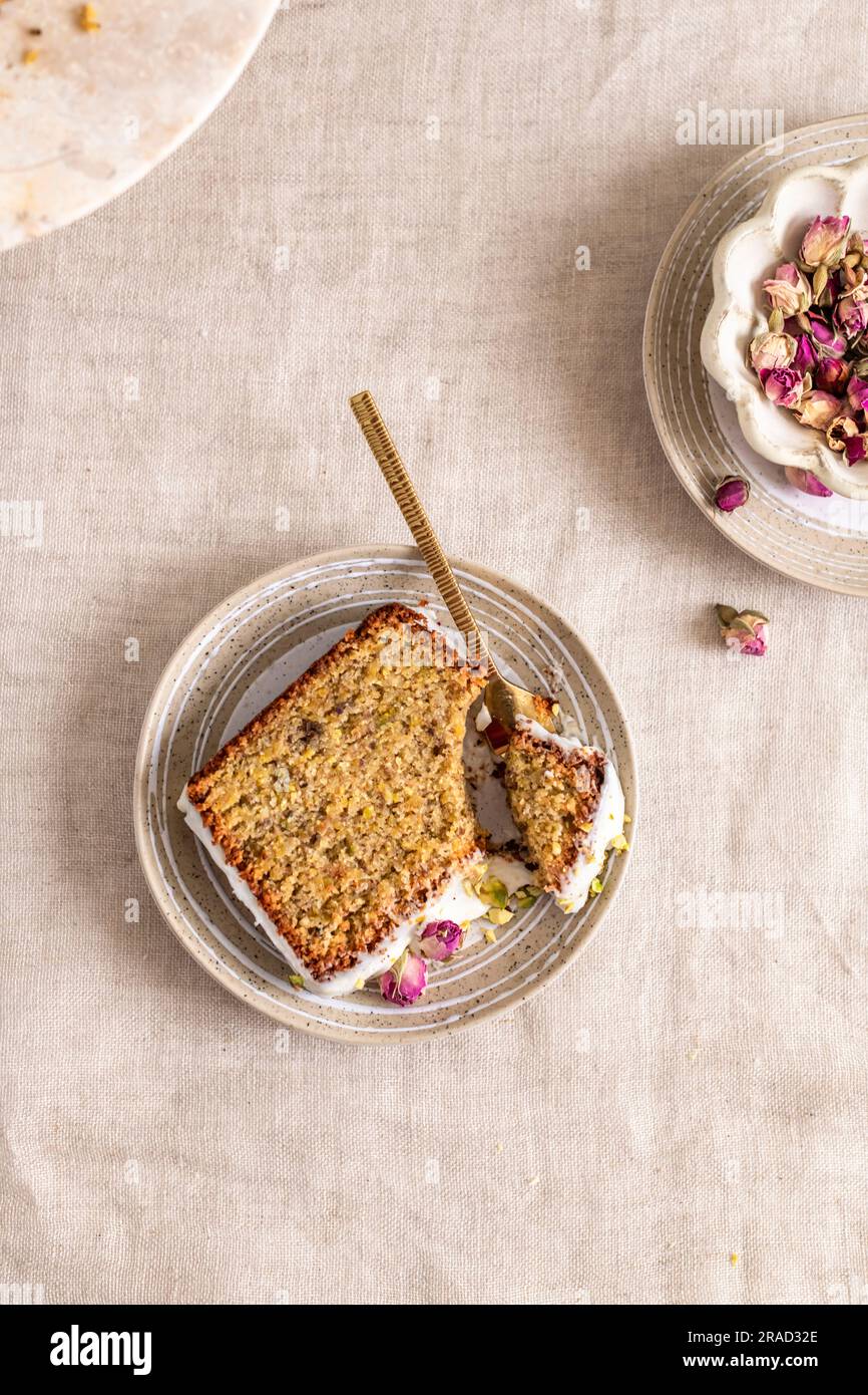 Glutenfree box cake with pistachios, lemon, and rose petals Stock
