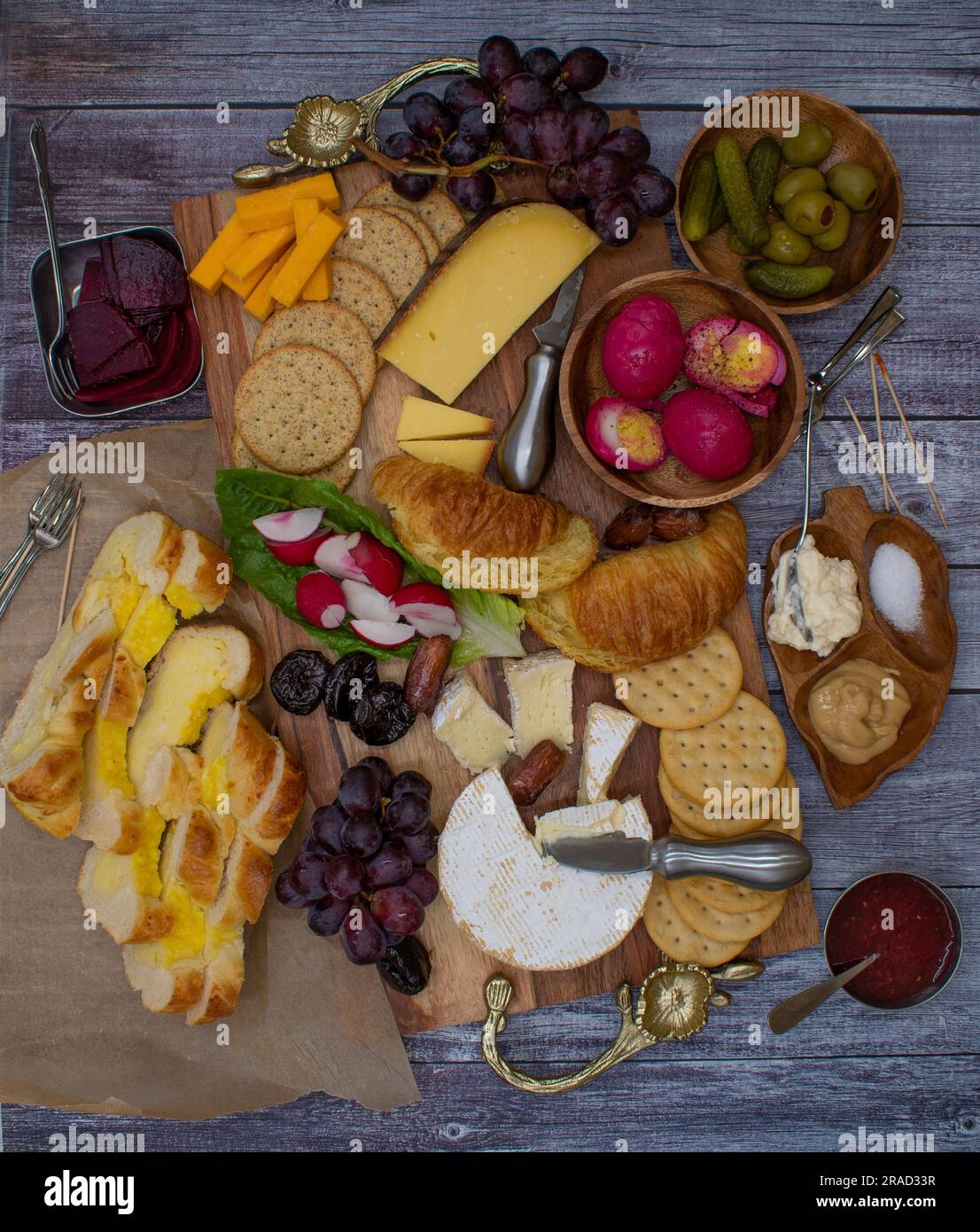 Vegetarian Easter brunch with various breads, eggs, cheese, fruit and gherkins Stock Photo