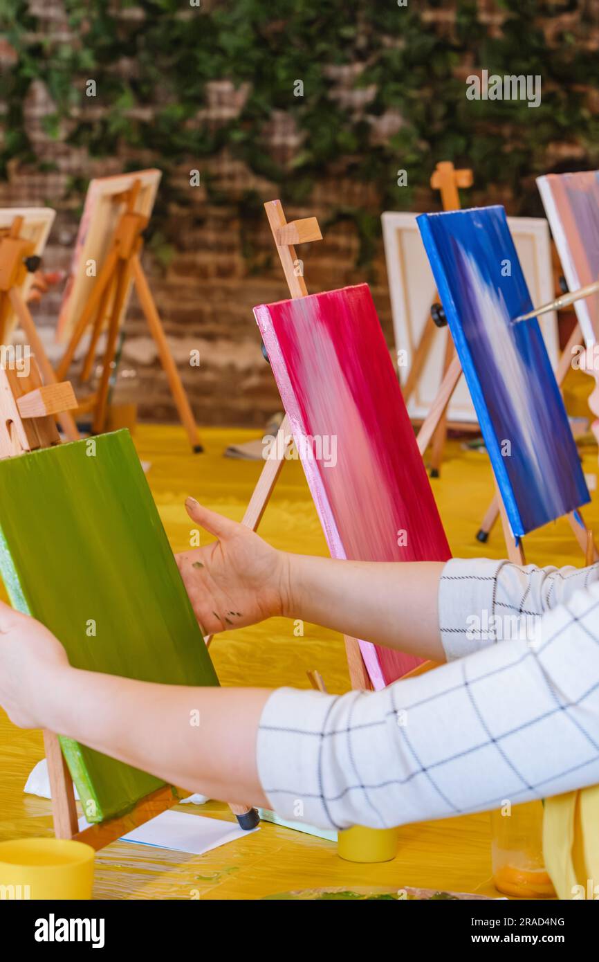 Woman artist holding paint brush hi-res stock photography and images ...
