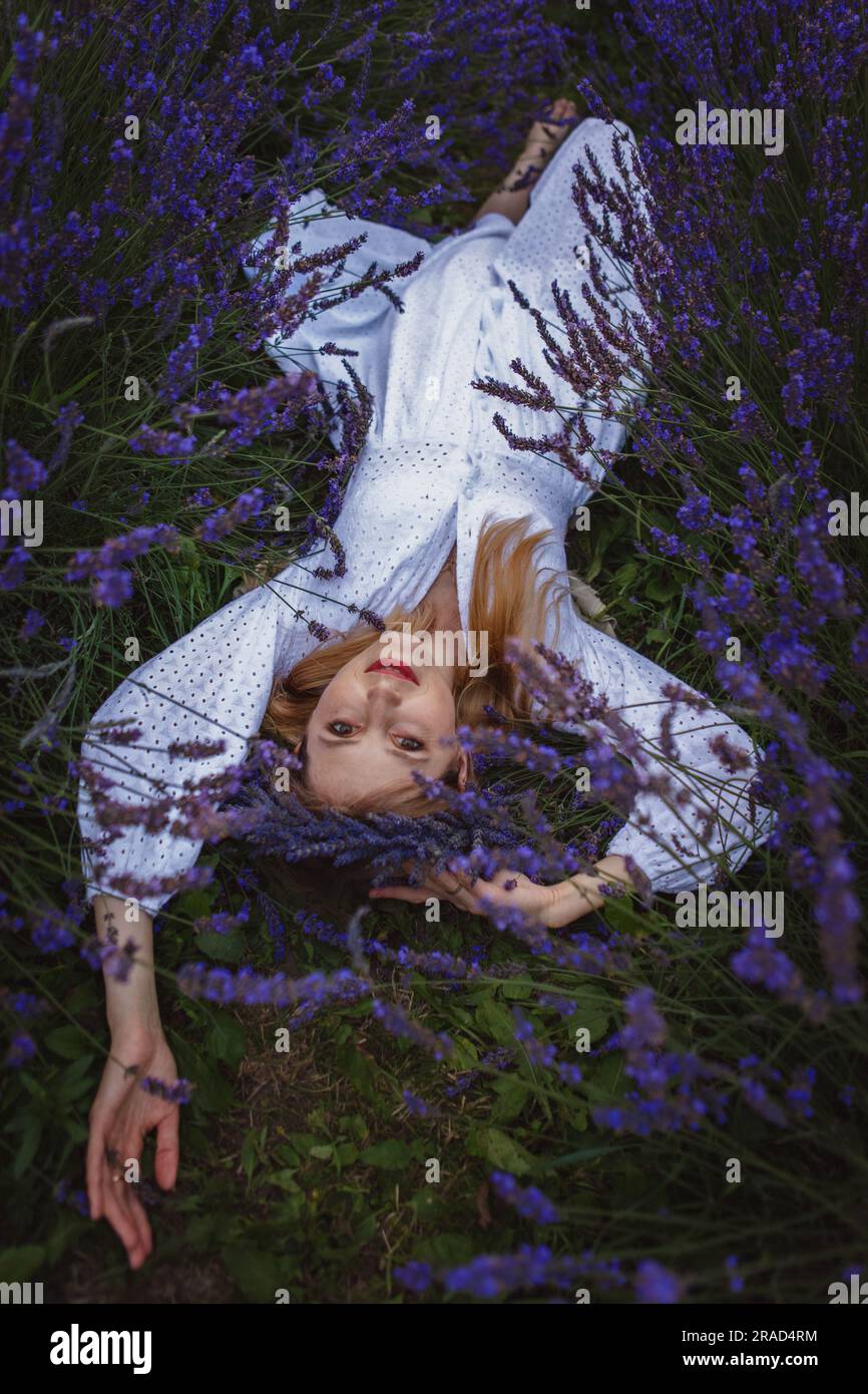 Woman wearing purple dress hi-res stock photography and images - Alamy