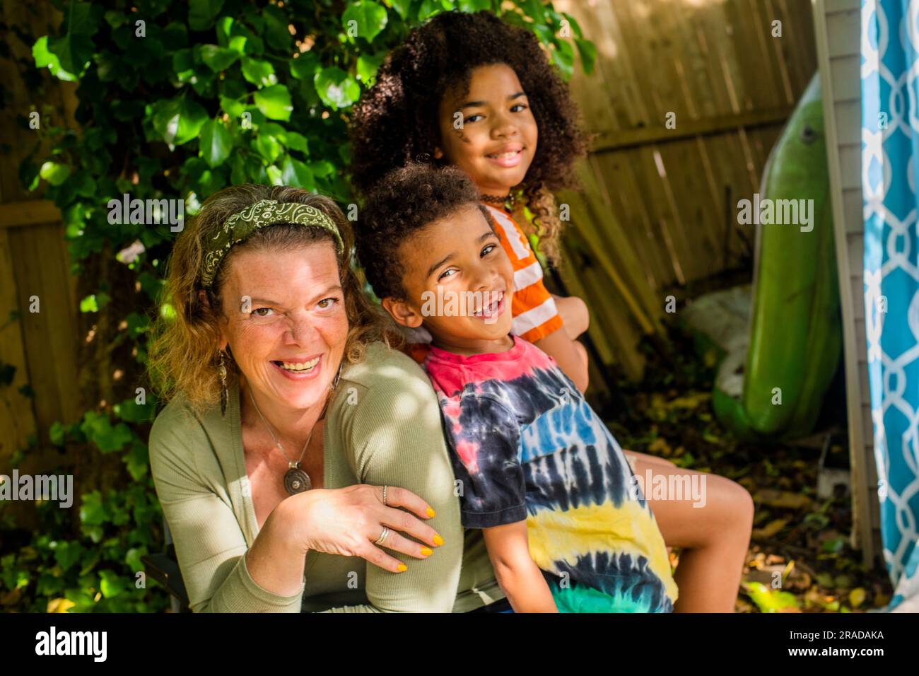Portrait of a family in backyard Stock Photo