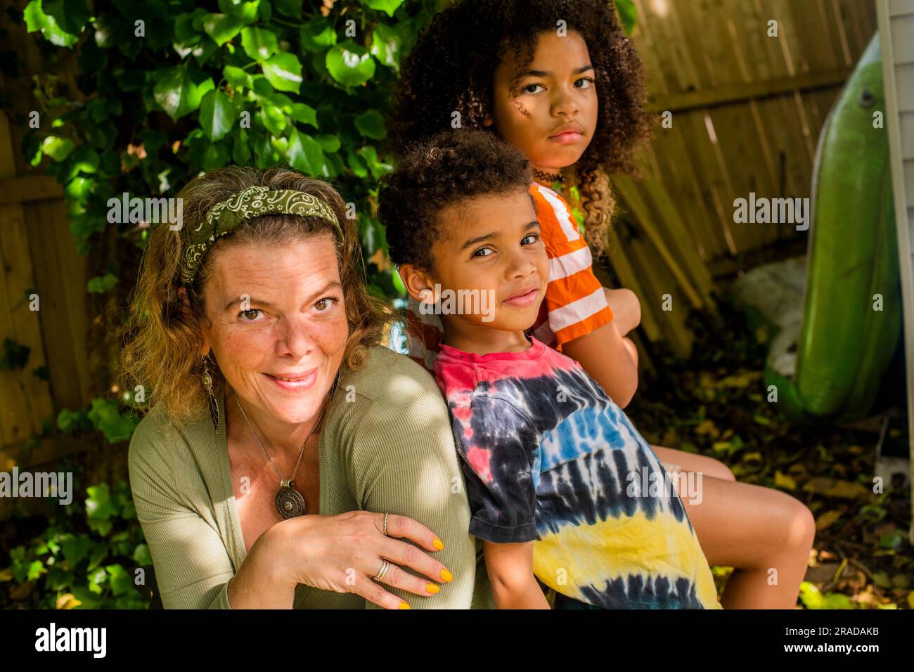 Portrait of a family in backyard Stock Photo