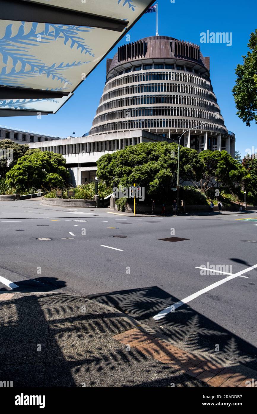 Parliament House known as 'The Beehive' under a clear blue sky on a quiet Sunday afternoon in central Wellington, New Zealand Stock Photo