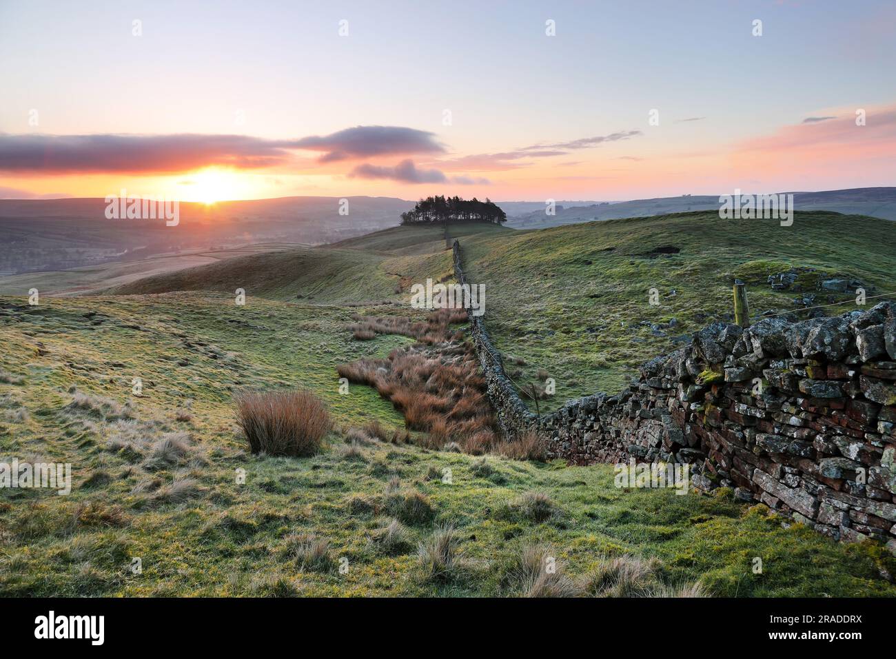 Kirkcarrion, Teesdale, County Durham, UK. 14th April 2023. UK Weather. There was a spectacular cold and frosty sunrise over the ancient Tumulus of Kir Stock Photo