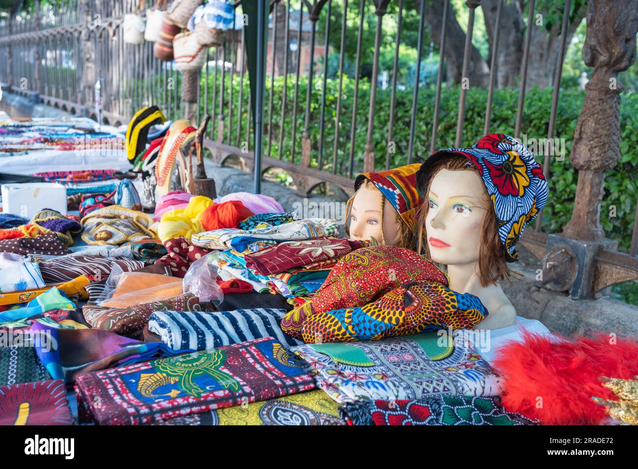 Colorful used accessories for women's clothing at a flea market in Palermo Stock Photo