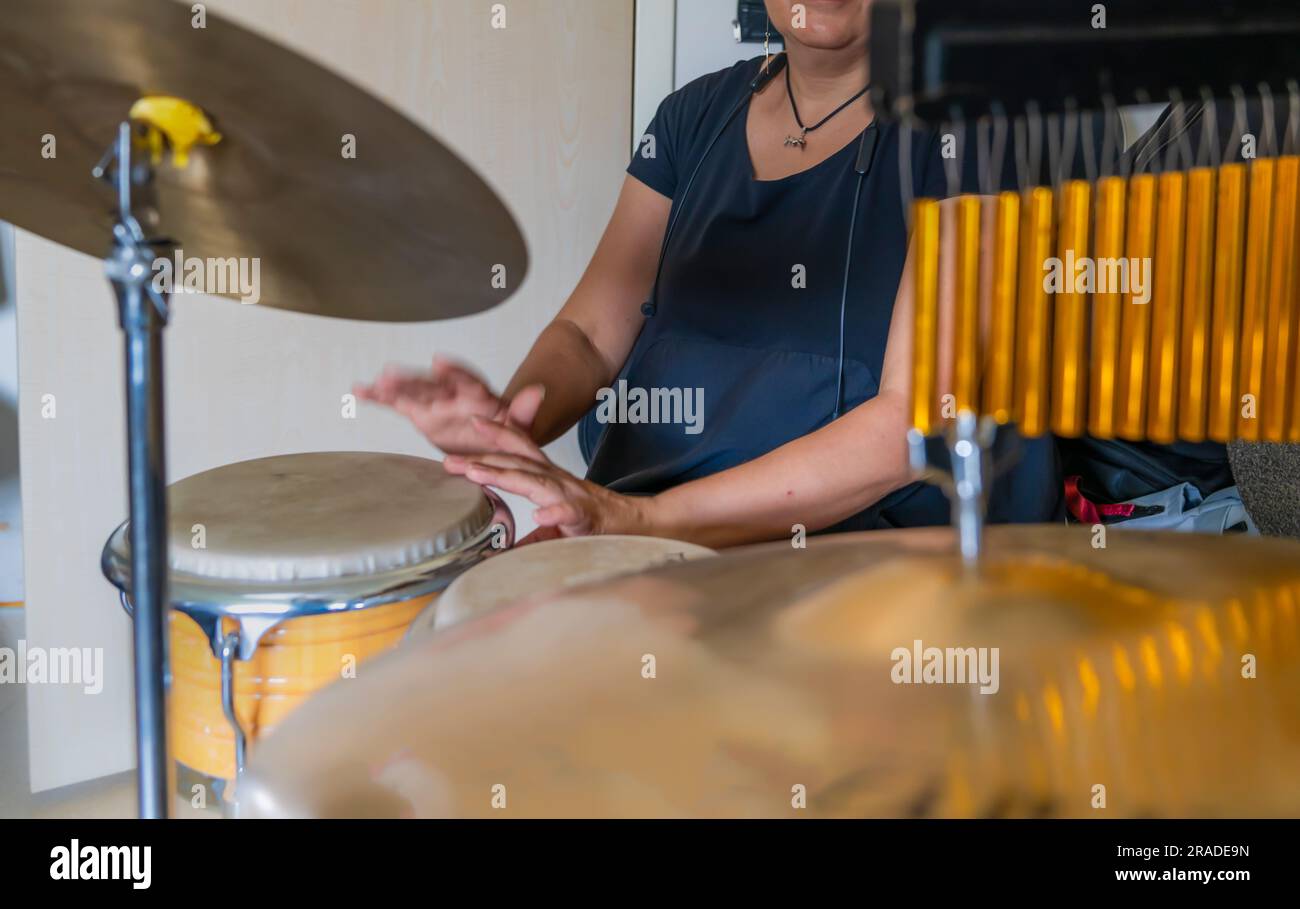 Playing percussion instruments together indoor Stock Photo Alamy