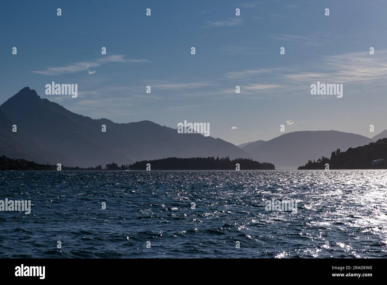 The beach at Frankton overlooking Lake Wakatipu and Cecil Peak on a