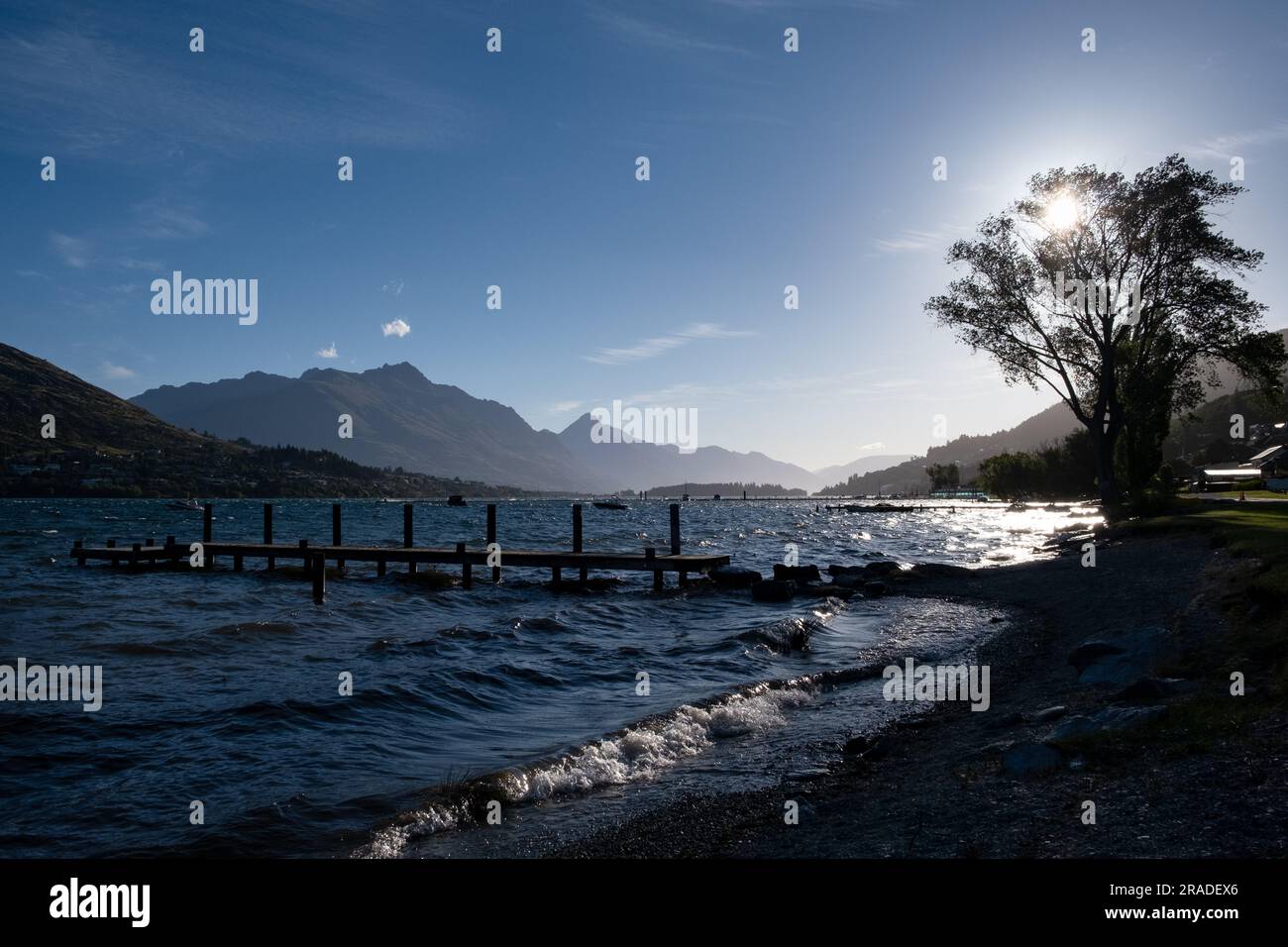 The beach at Frankton overlooking Lake Wakatipu and Cecil Peak on a