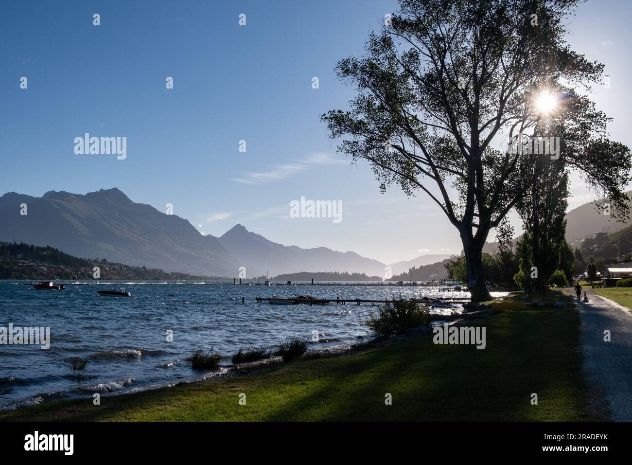 The beach at Frankton overlooking Lake Wakatipu and Cecil Peak on a