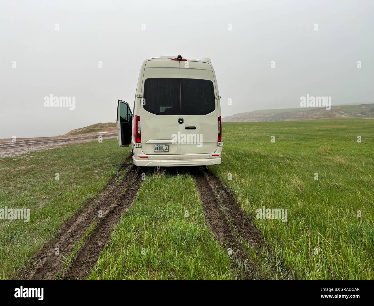 Wall sd usa may 13 2023 a rv sprinter van stuck in the mud in the