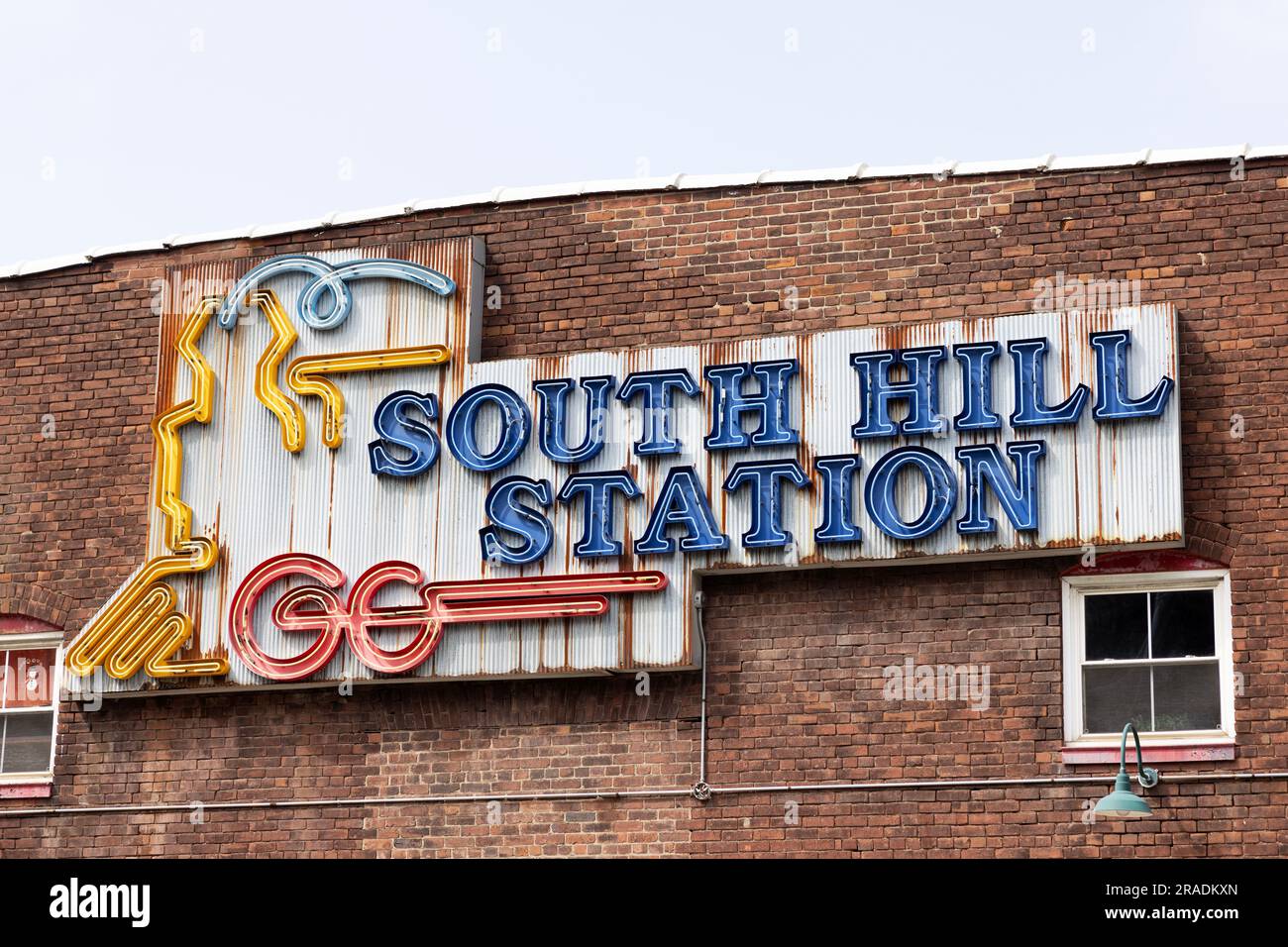 Neon sign on the building at South Hill Station on Bolivar Street in