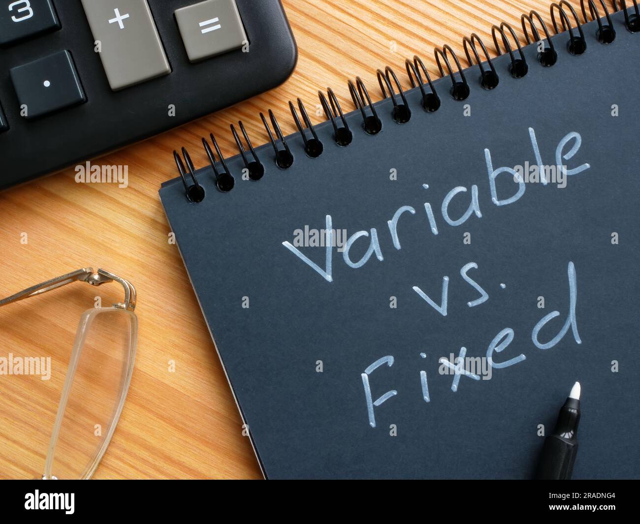 Handwritten inscription variable vs fixed by marker Stock Photo Alamy