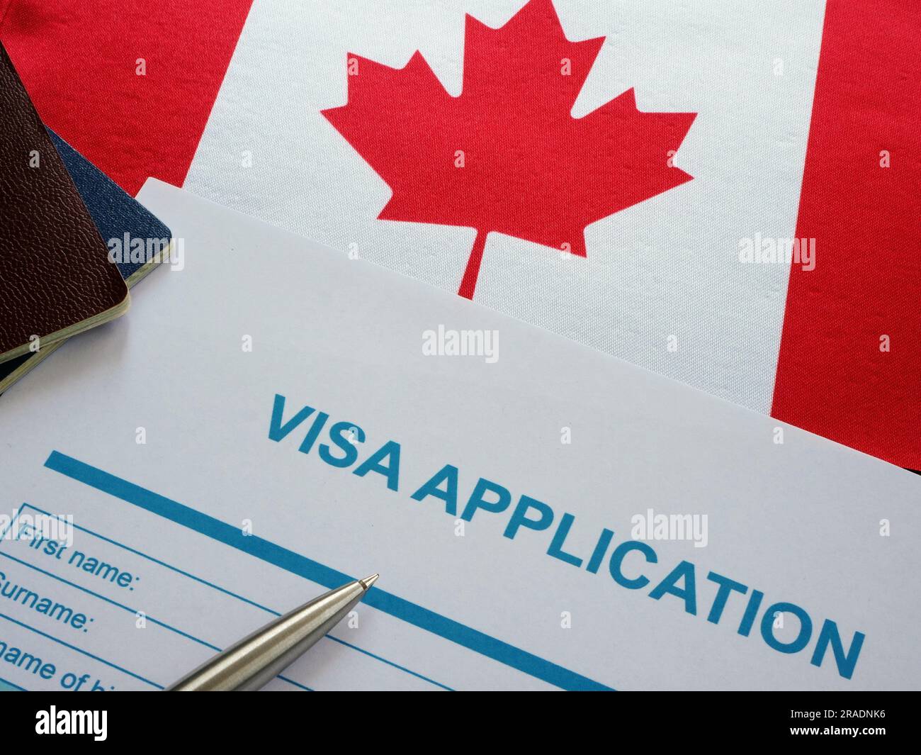 Empty visa application form and Canada flag. Stock Photo