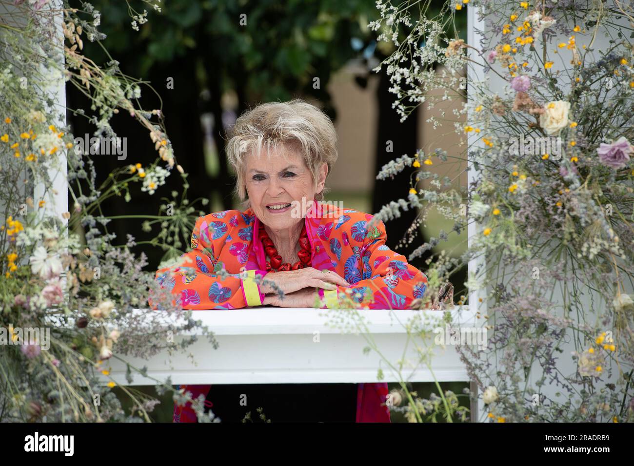 East Molesey, Surrey, UK. 3rd July, 2023. Loose Women and TV Personality Gloria Hunniford poses for a photo behind the RHS letters at the Hampton Court Palace Garden Festival Press Day. Credit: Maureen McLean/Alamy Live News Stock Photo