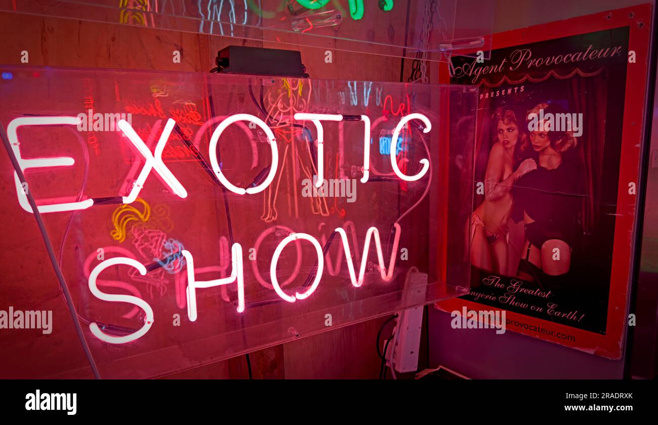 Soho red neon invites into peep shows, exotic performances, live lap dance shows, in London's West End entertainment district Stock Photo