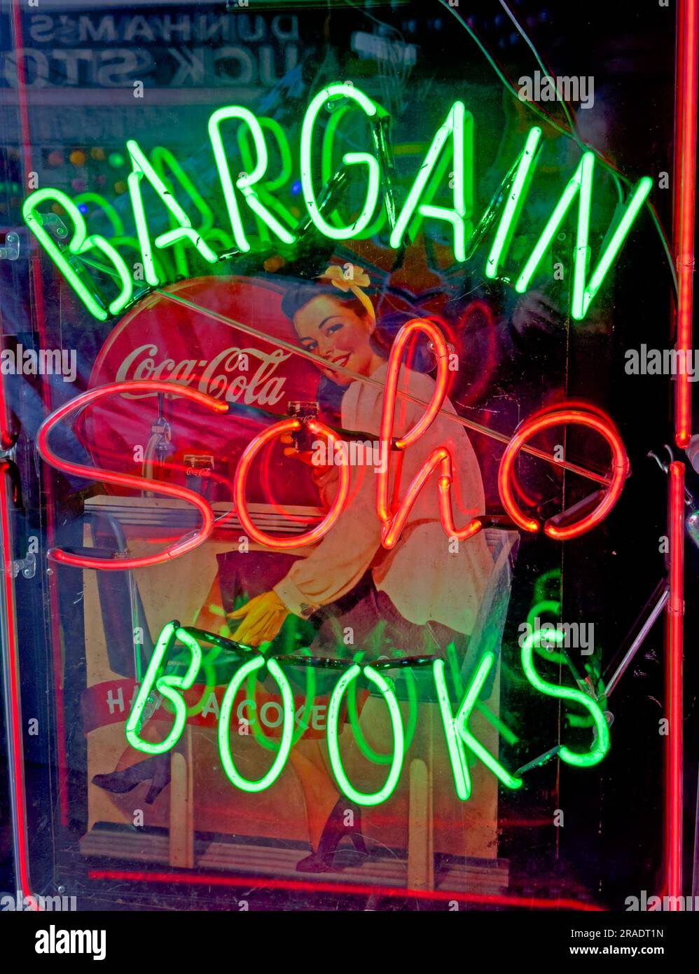 Soho red neon invites into erotic book and magazine shops, sex aid stores, in London's West End entertainment district Stock Photo