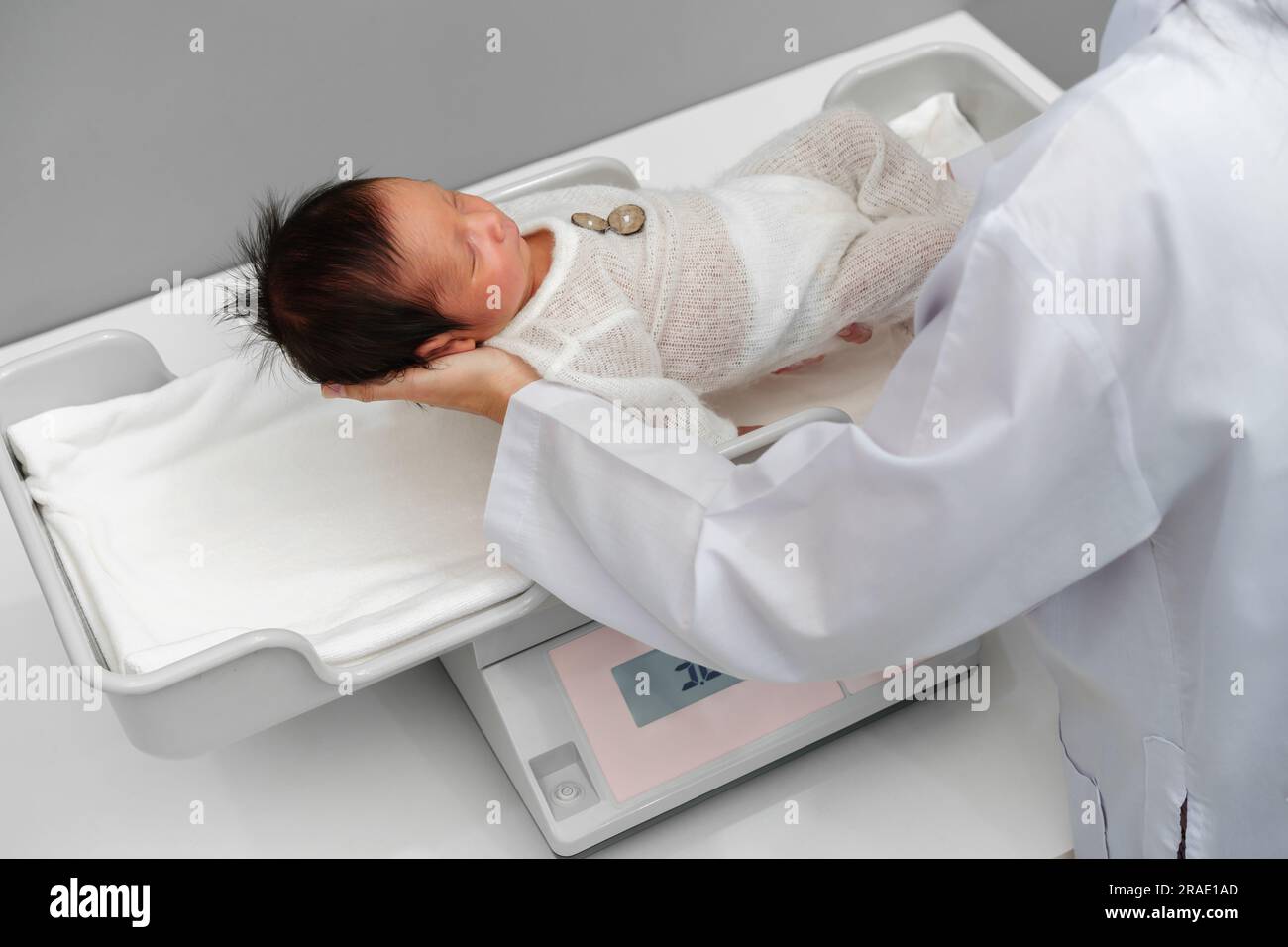 Baby boy birth weight on hospital scales Stock Photo - Alamy