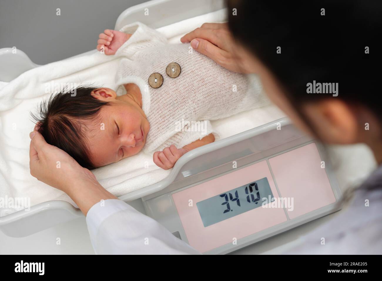 Newborn Baby On Scale. Physical Development Concept Photo Of Child Health  Care. Copy Space Stock Photo, Picture and Royalty Free Image. Image  45837323.