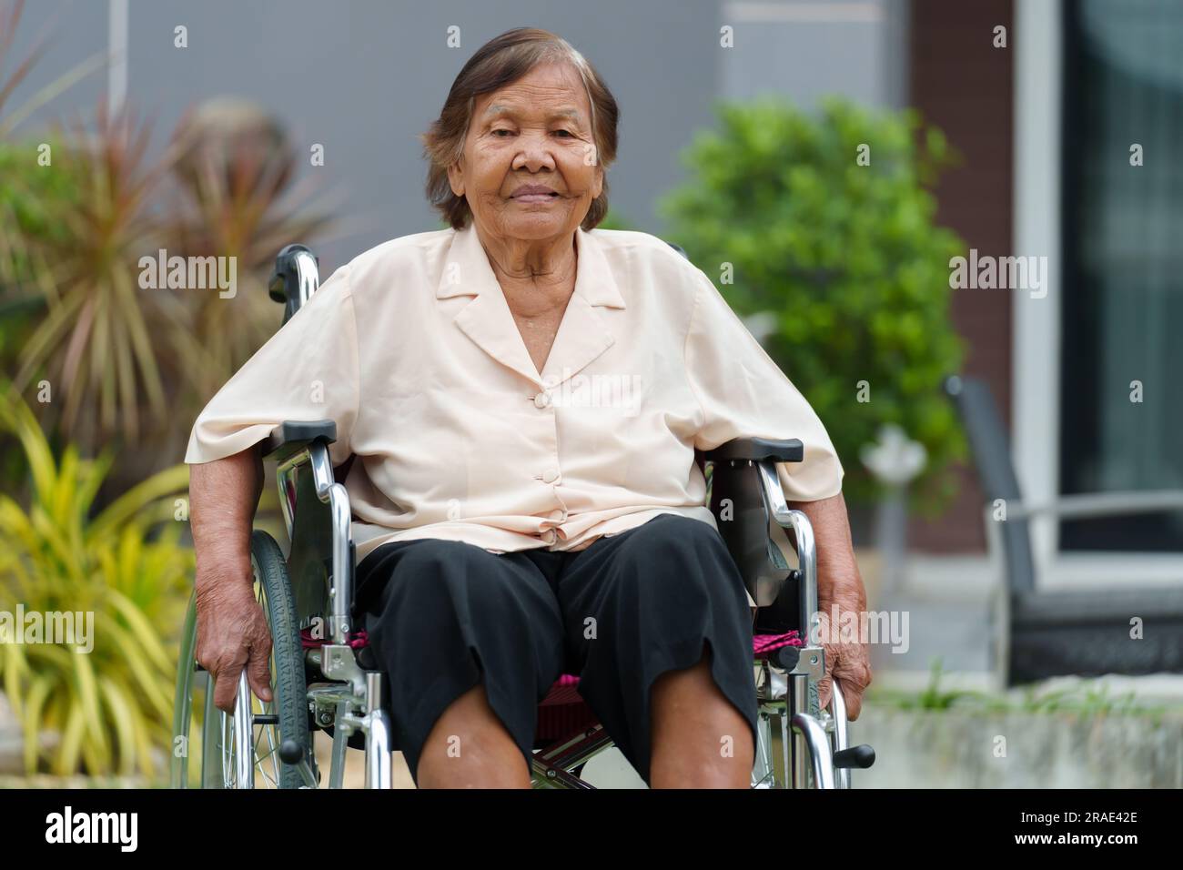 Woman laughing in wheelchair hi-res stock photography and images - Alamy