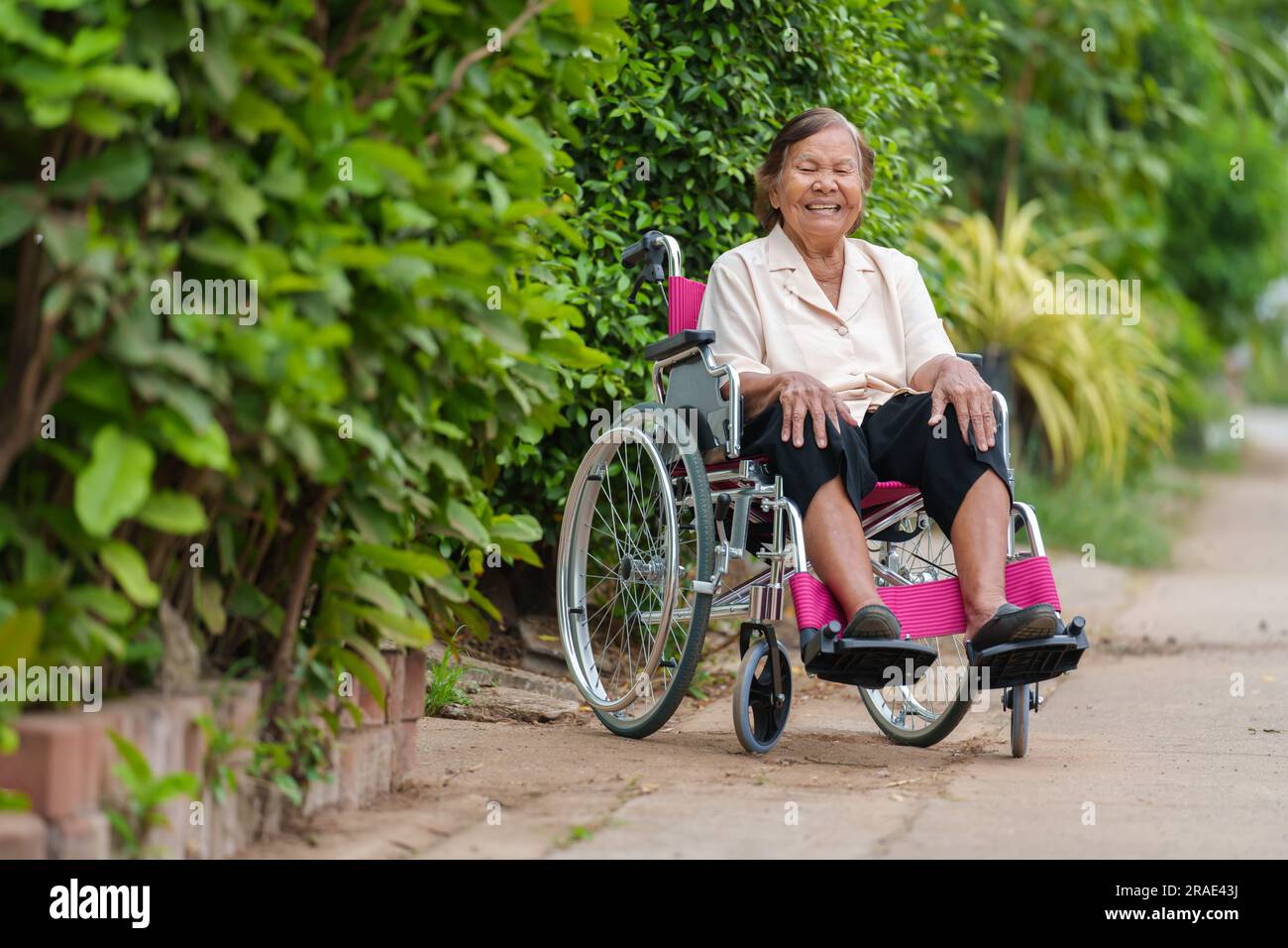 Old woman in wheelchair happy hi-res stock photography and images - Alamy