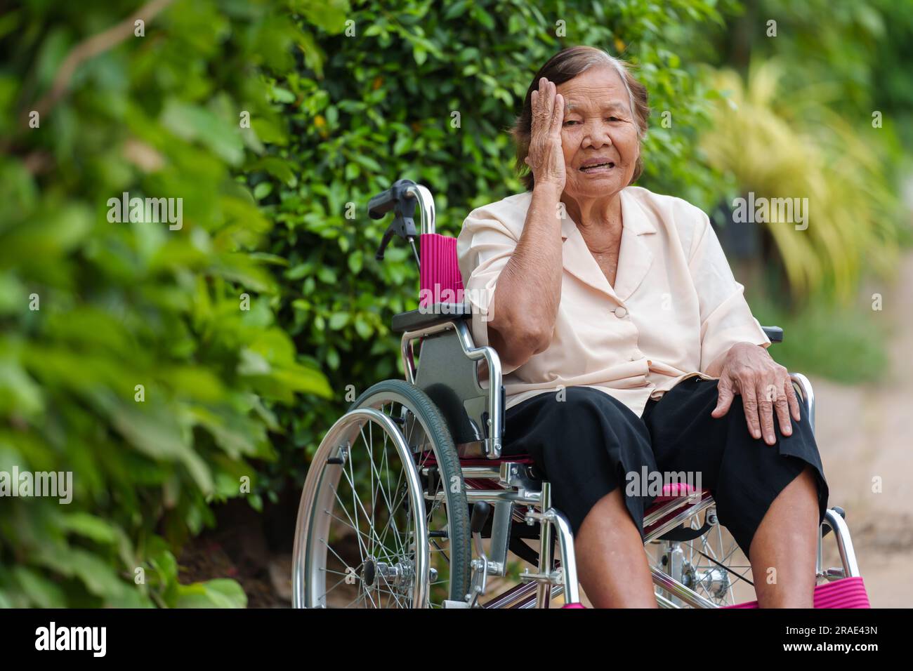 Sad old woman in wheelchair hi-res stock photography and images - Alamy