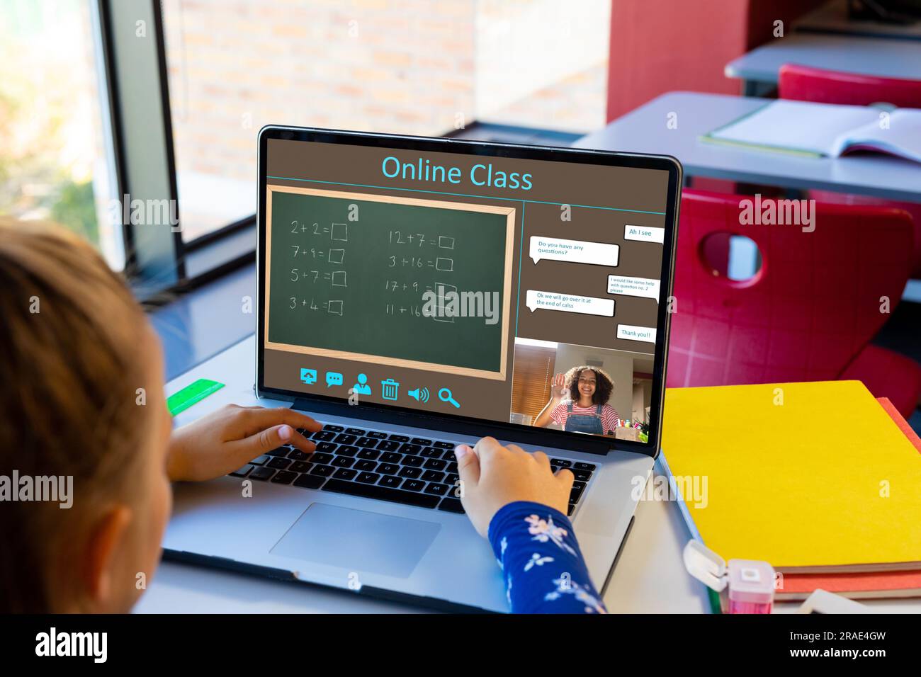 Diverse schoolgirl with female teacher having class during laptop video ...